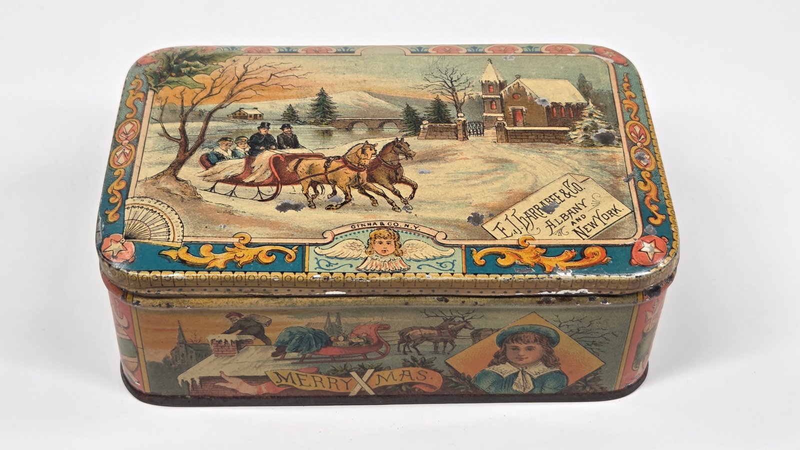 E.J. GARRABEE & CO. ADVERTISING CHRISTMAS TIN: REMAINS IN GOOD CONDITION, SHOWING SOME TYPICAL WEAR.