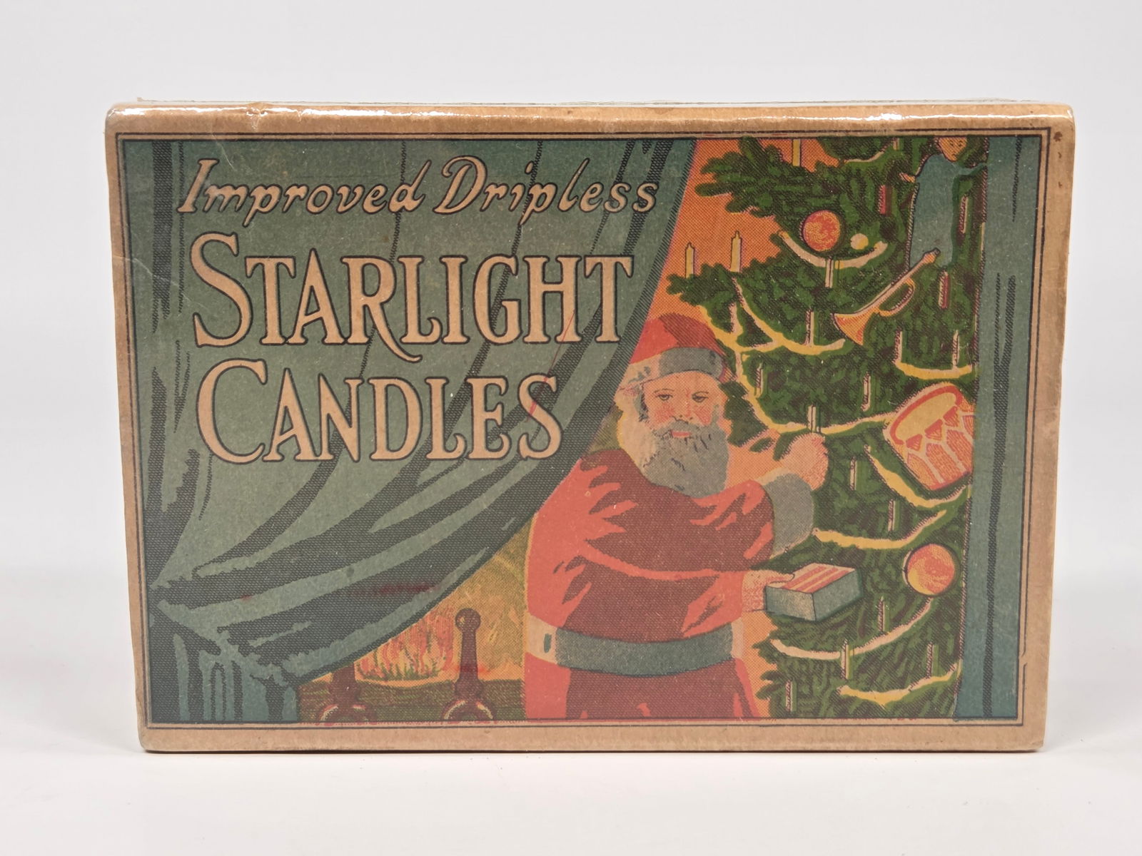 IMPROVED DRIPLESS STARLIGHT CANDLE SANTA BOX: REMAINS UNOPENED / FULL. BOX PLASTIC WRAPPED TO PROTECT.