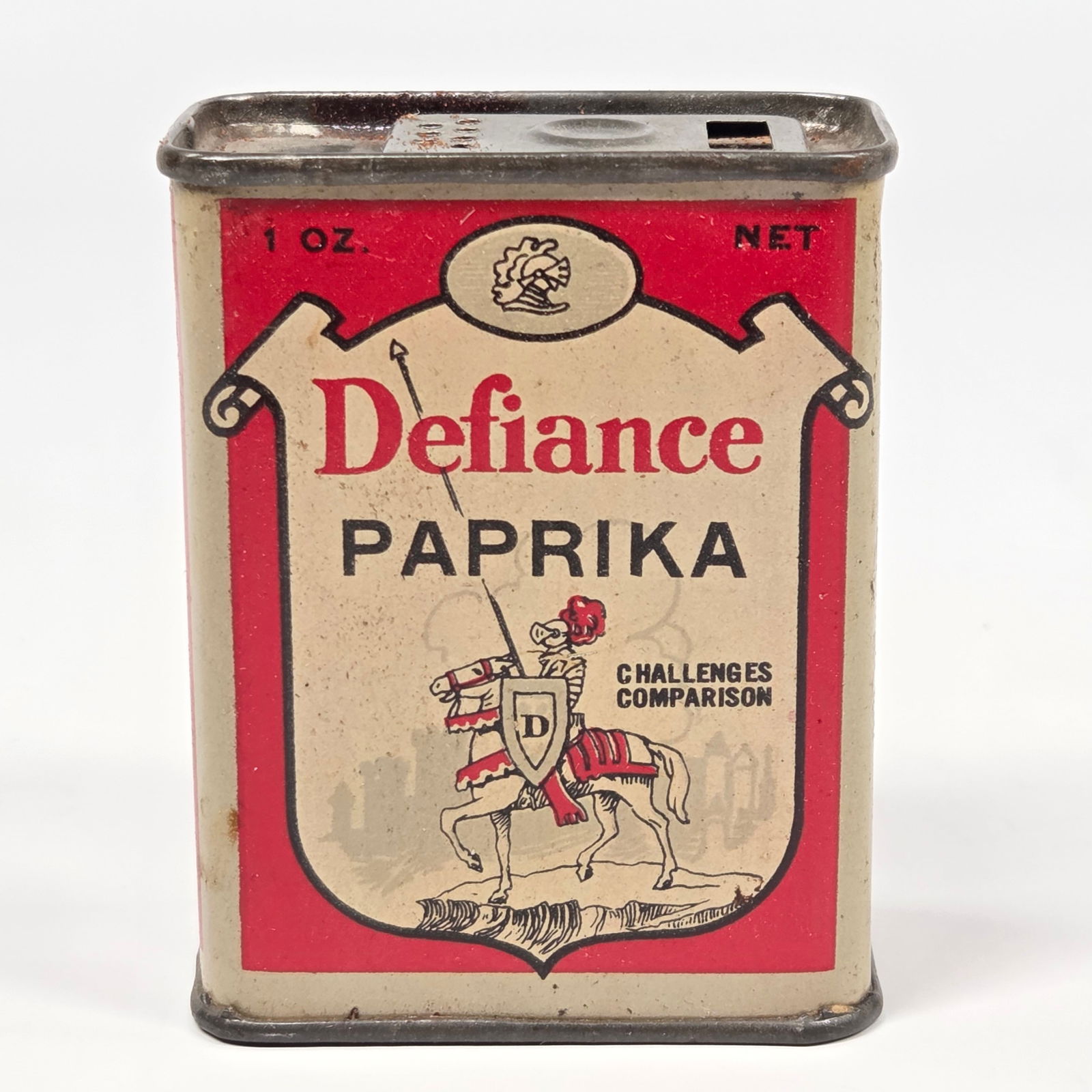 DEFIANCE 1 OZ. PAPRIKA SPICE TIN: REMAINS IN GOOD CONDITION, SHOWING SOME TYPICAL WEAR.