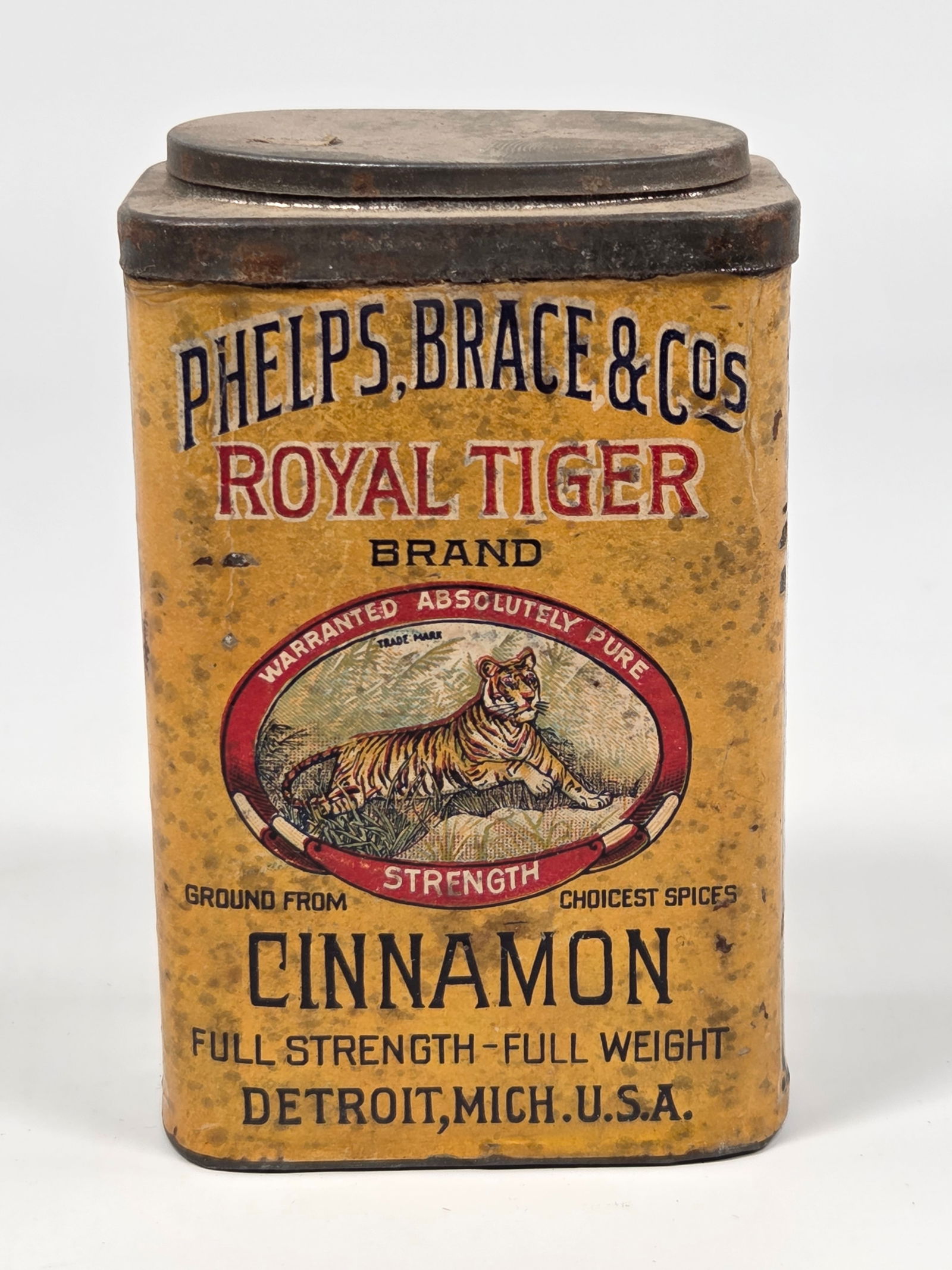 PHELPS, BRANCE & CO. ROYAL TIGER CINNAMON SPICE TIN: PAPER LABEL REMAINS IN GOOD CONDITION, SHOWING SOME TYPICAL WEAR WITH STAINING.