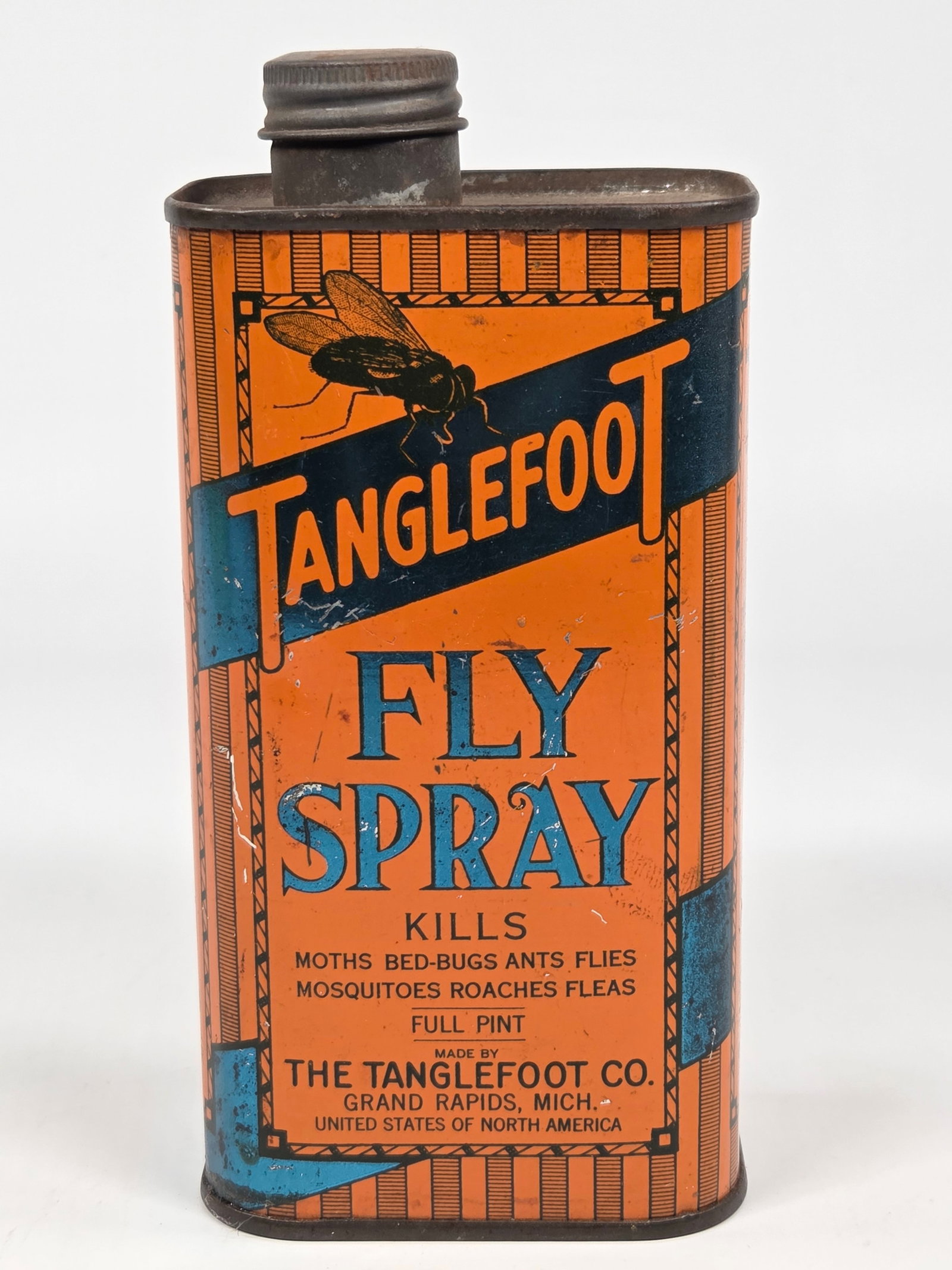 TANGLEFOOT CO. FLY SPRAY ADVERTISING TIN: REMAINS IN GOOD CONDITION, SHOWING SOME TYPICAL WEAR.