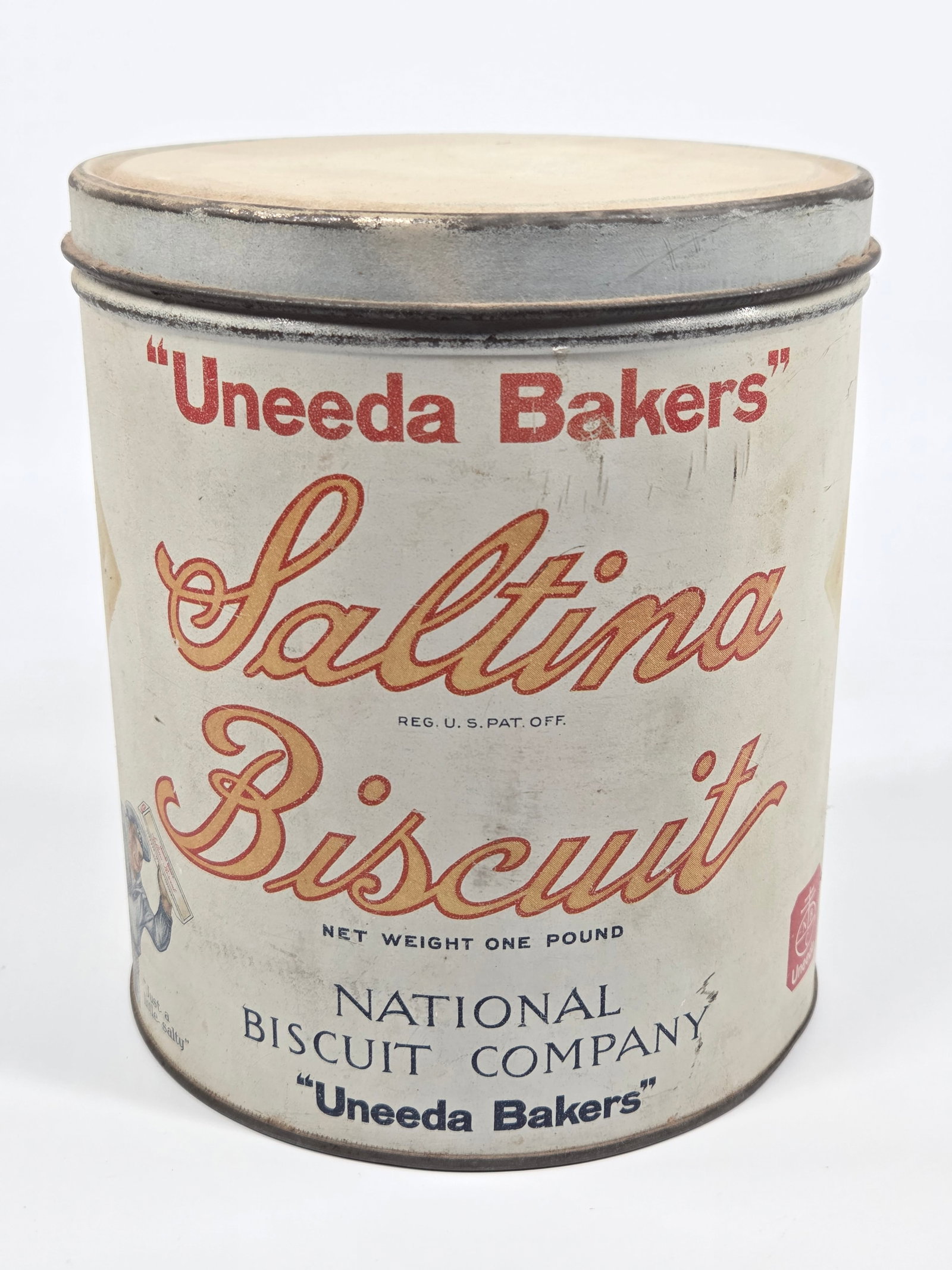 NATIONAL BISCUIT COMPANY UNEEDA BAKERS SALTINA BISCUIT TIN: REMAINS IN GOOD CONDITION, SHOWING SOME TYPICAL WEAR.