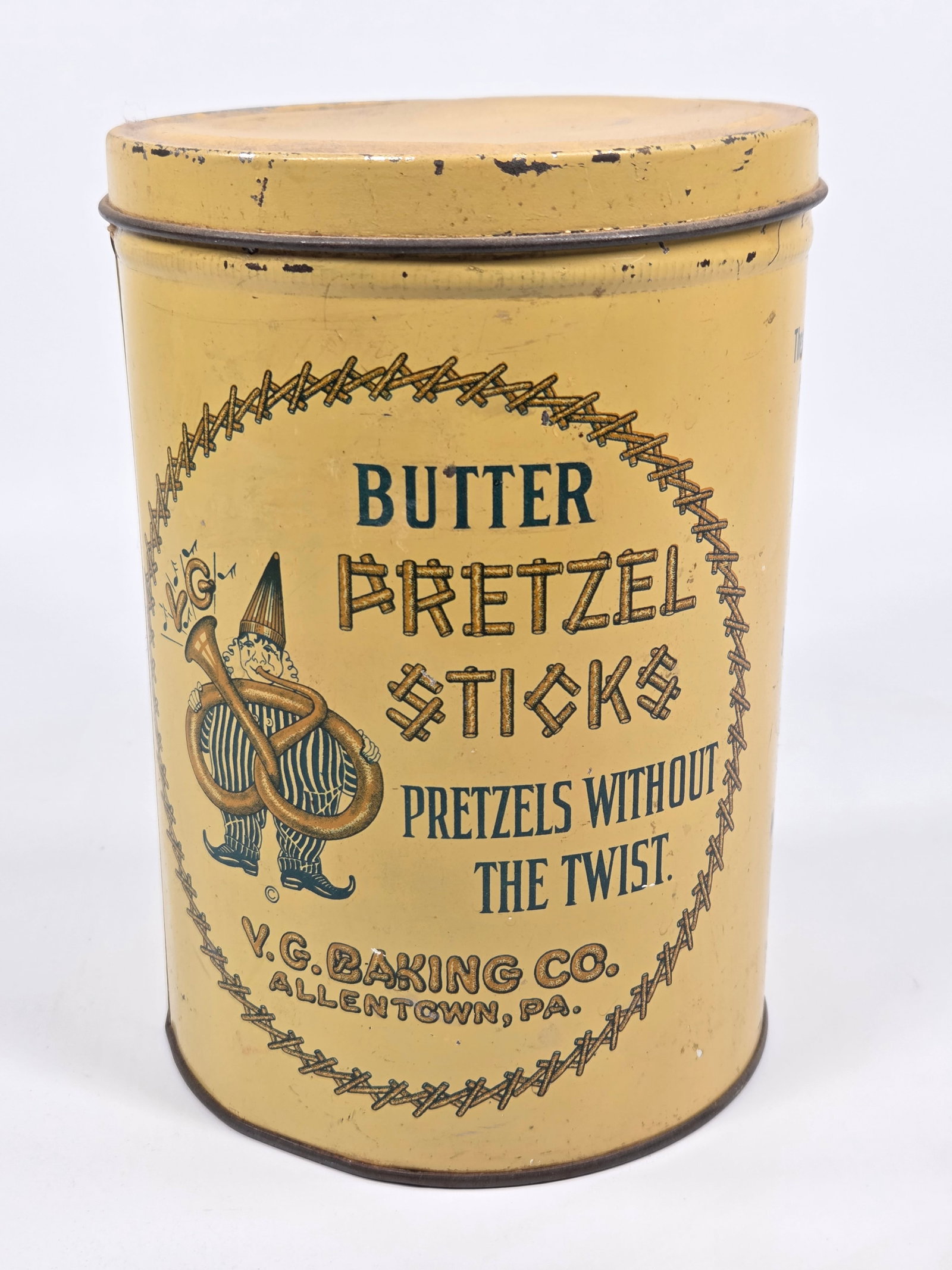 V.G. BAKING CO. BUTTER PRETZEL STICKS ADVERTISING TIN: REMAINS IN GOOD CONDITION, SHOWING SOME TYPICAL WEAR.