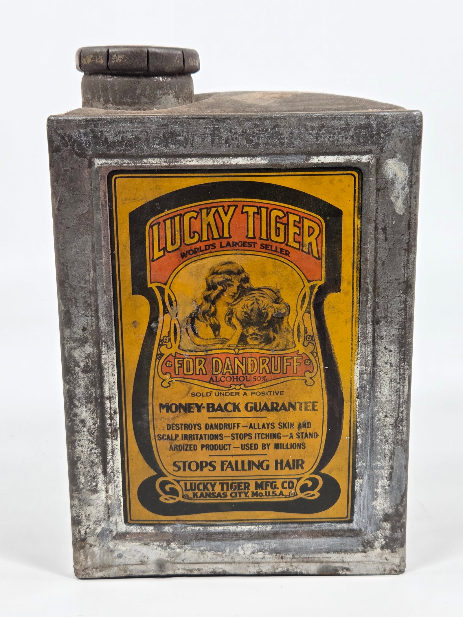 ANTIQUE LUCKY TIGER MFG. CO. DANDRUFF TIN: LABELS REMAIN IN GOOD CONDITION. TIN SHOWING SOME TYPICAL WEAR.