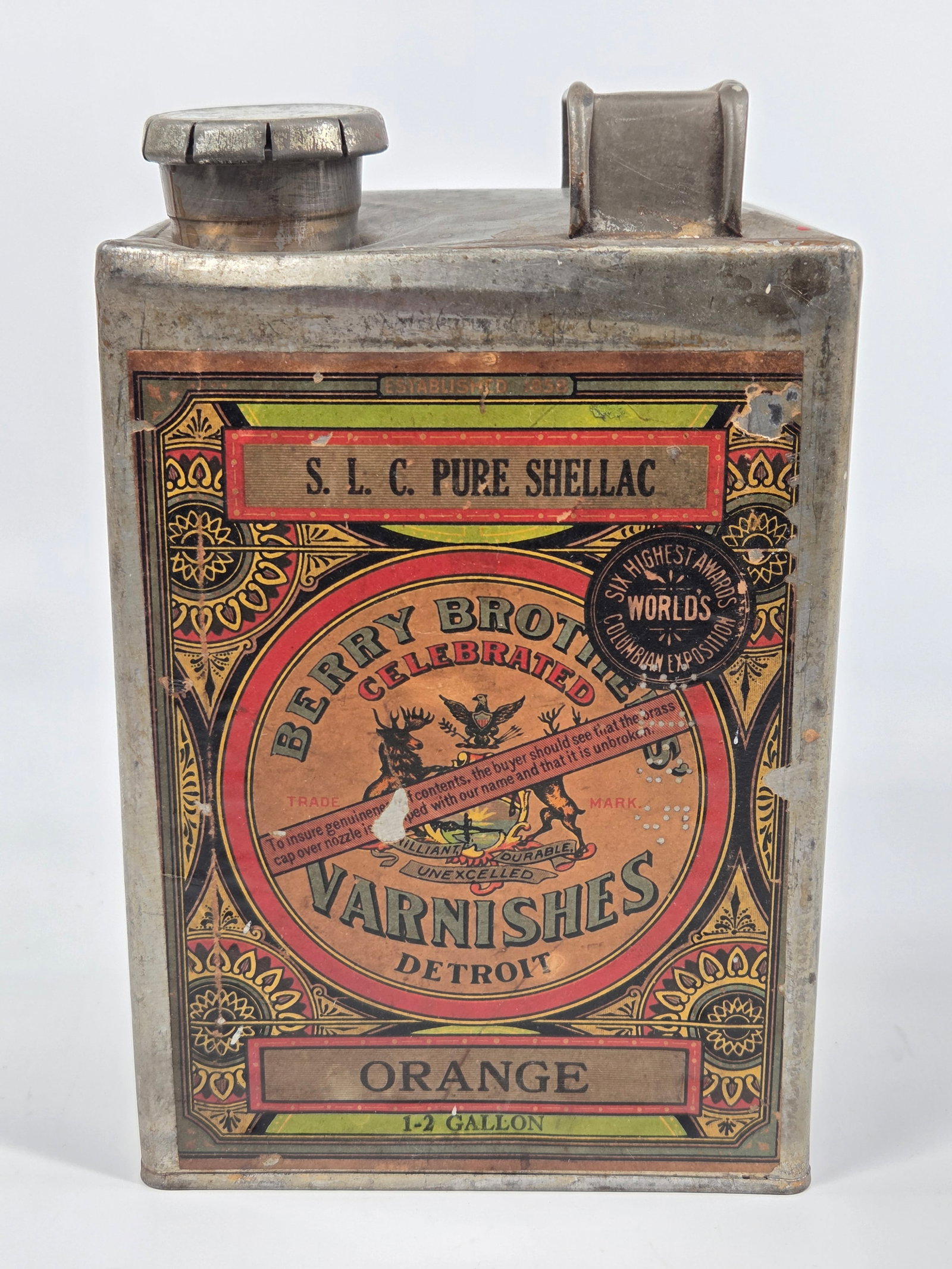 BERRY BROTHERS' VARNISH S.L.C. PURE SHELLAC ORANGE TIN: PAPER LABEL SHOWING SOME WEAR, OVERALL REMAINS IN GOOD CONDITION. REMAINS REMAINS IN GOOD CONDITION, SHOWING SOME TYPICAL WEAR.