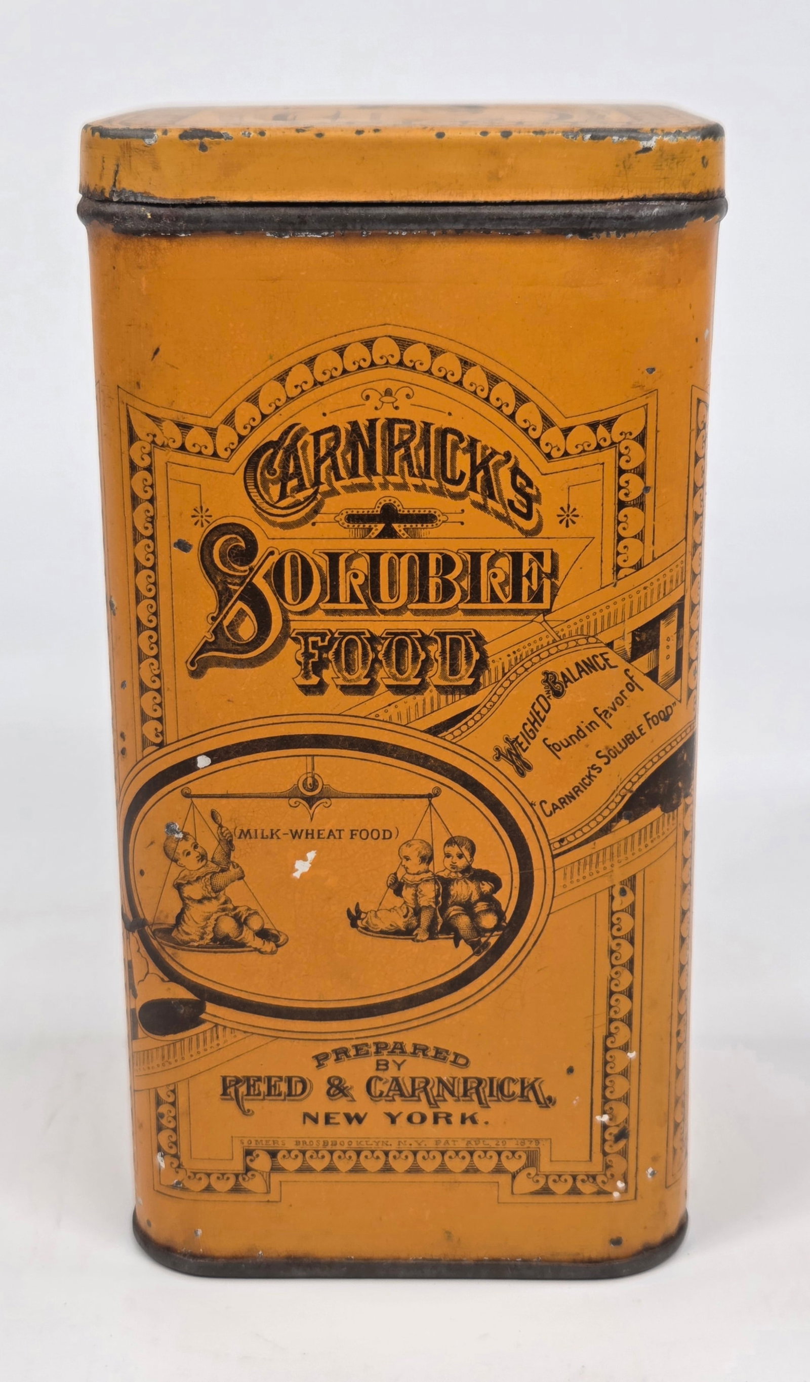 REED & CARNRICK SOLUBLE FOOD TIN: REMAINS IN GOOD CONDITION, SHOWING SOME TYPICAL WEAR.