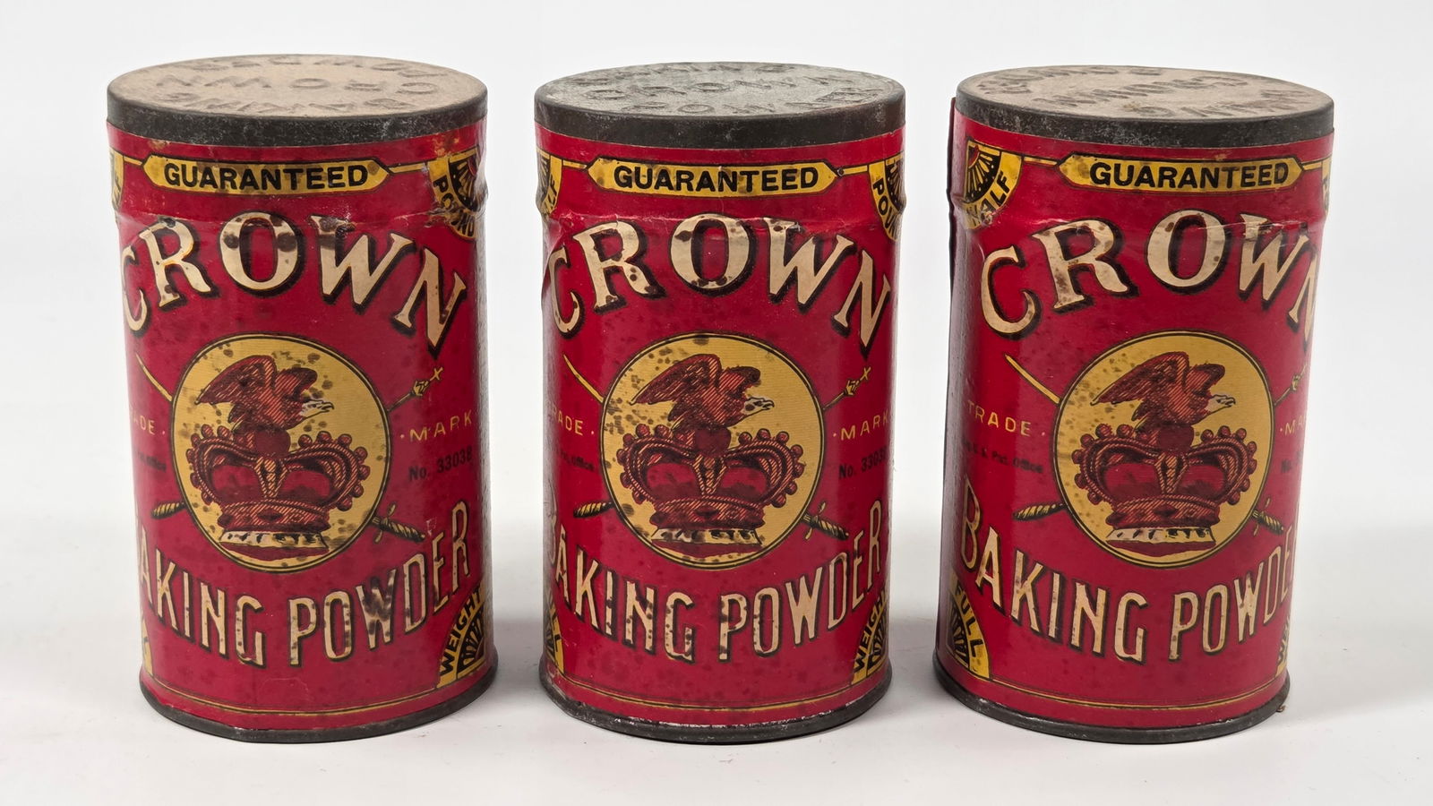 3) CROWN BAKING POWDER TINS W/ PAPER LABELS: ALL REMAIN FACTORY SEALED UNUSED, SHOWING SOME TYPICAL STORAGE WEAR.