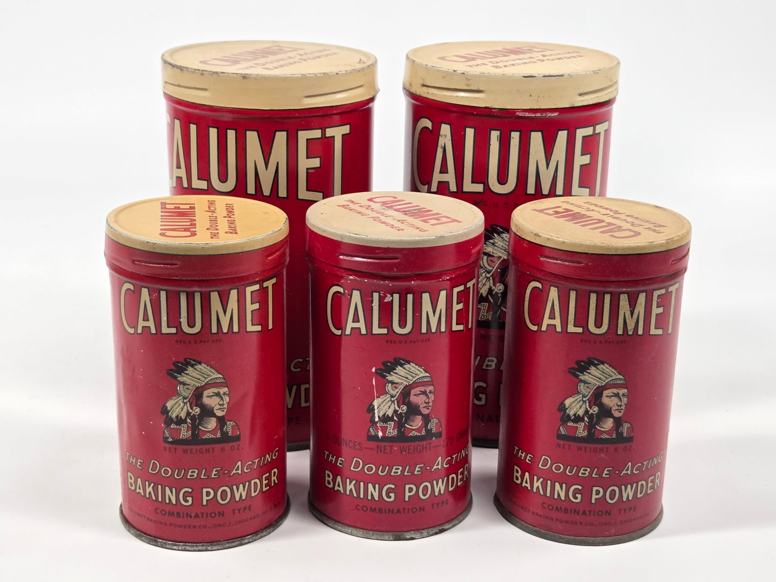 5) CALUMET BAKING POWDER ADVERTISING TINS: ALL REMAIN IN GOOD CONDITION, SHOWING SOME TYPICAL WEAR.