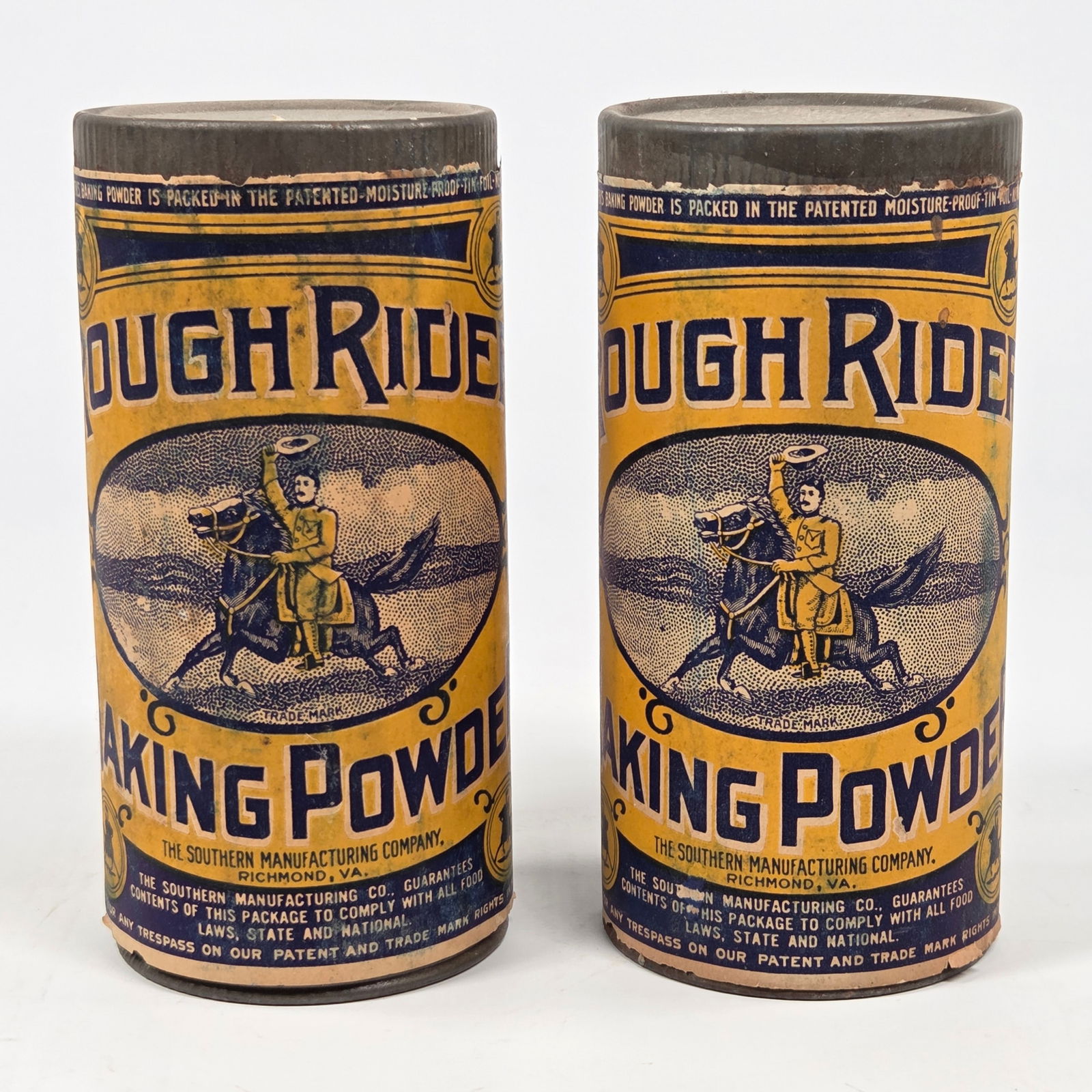 2) ROUGH RIDER BAKING POWDER 5 1/2 OZ. CONTAINER - UNOPENED: BOTH REMAIN IN FAIR TO GOOD UNOPENED CONDITION. PAPER LABELS REMAIN NICE, SHOWING SOME WEAR.