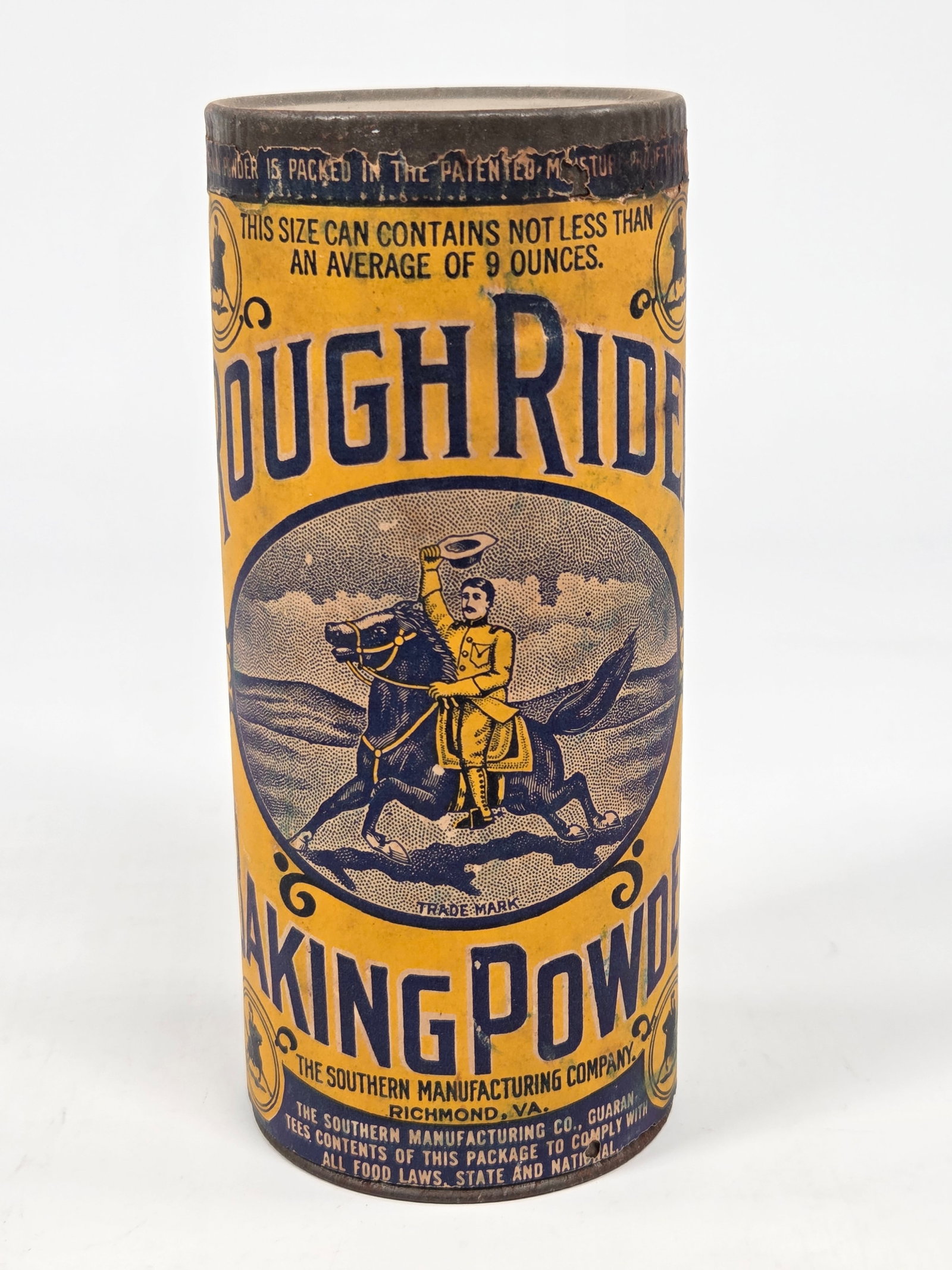 ROUGH RIDER BAKING POWDER 9 OZ. CONTAINER - UNOPENED: REMAINS IN GOOD UNOPENED CONDITION, SHOWING SOME TYPICAL WEAR.