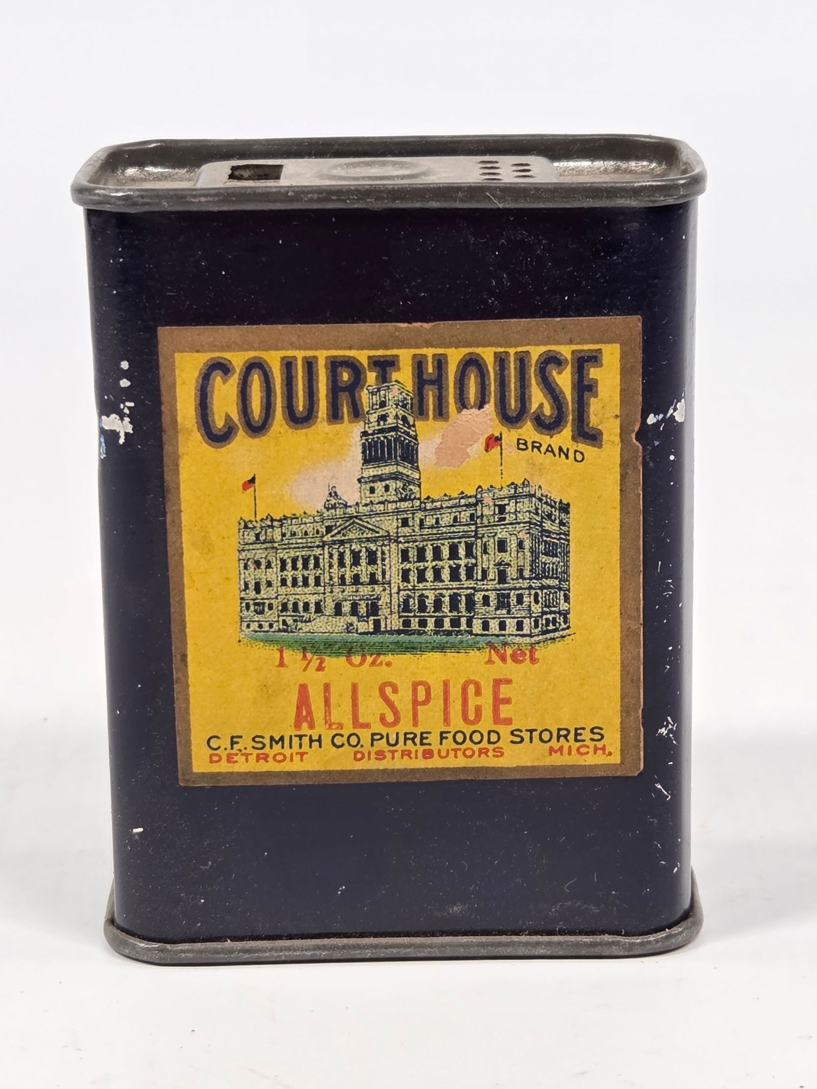 C.F. SMITH & CO. COURTHOUSE BRAND ALLSPICE TIN: REMAINS IN GOOD CONDITION, SHOWING SOME TYPICAL WEAR. PAPER LABEL REMAINS NICE.
