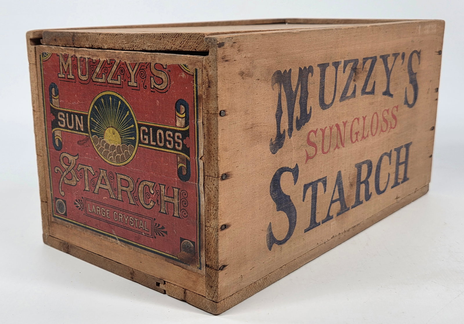 MUZZY'S SUN GLOSS STARCH WOOD BOX W/ SLIDE LID & LABEL: REMAINS IN GOOD ORIGINAL CONDITION, SHOWING SOME TYPICAL WEAR. ORIGINAL PAPER LABEL ON END SHOWS WEAR WITH SOME TEARS. SLIDE LID, DOES NOT SLIDE SMOOTHLY.