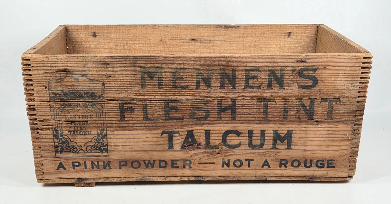 MENNEN'S FLESH TIN TALCUM POWDER WOOD STORE BOX: REMAINS IN GOOD ORIGINAL CONDITION, SHOWING SOME TYPICAL WEAR.