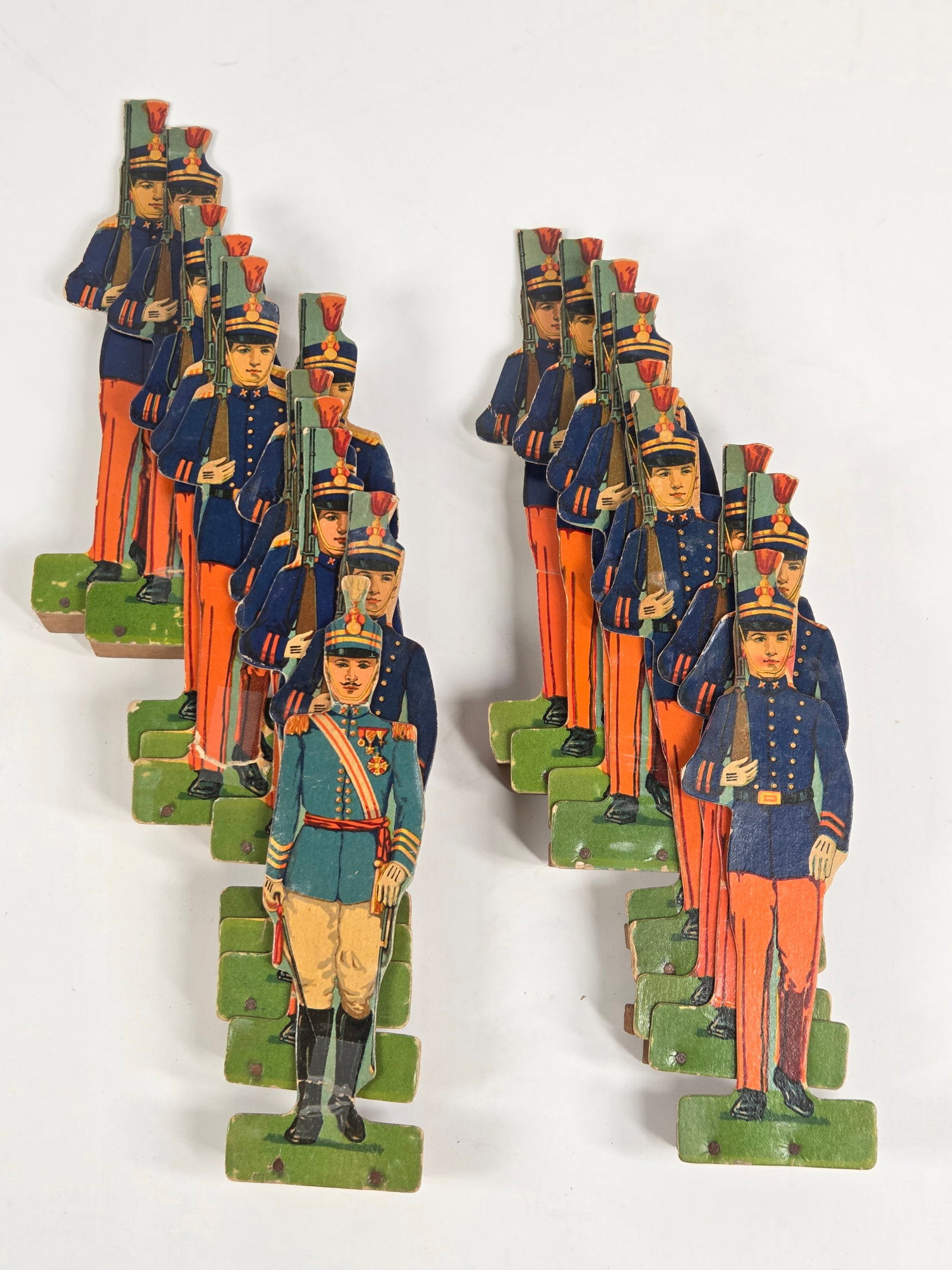 VARIOUS McLOUGHLIN CARDBOARD SOLDIER GAME PIECES: ALL REMAIN IN FAIR TO GOOD CONDITION, SOME SHOWING MORE WEAR THAN OTHERS.