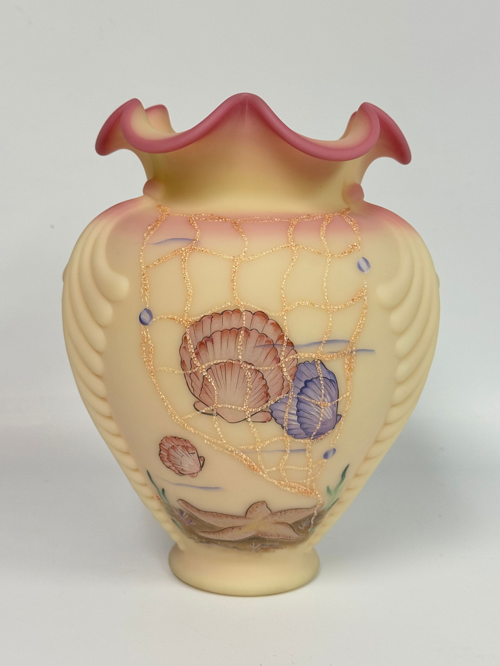 1995 FENTON BURMESE SEA DREAMS VASE: REMAINS IN EXCELLENT CONDITION WITH ORIGINAL PAPERWORK. NO CHIPS OR CRACKS.