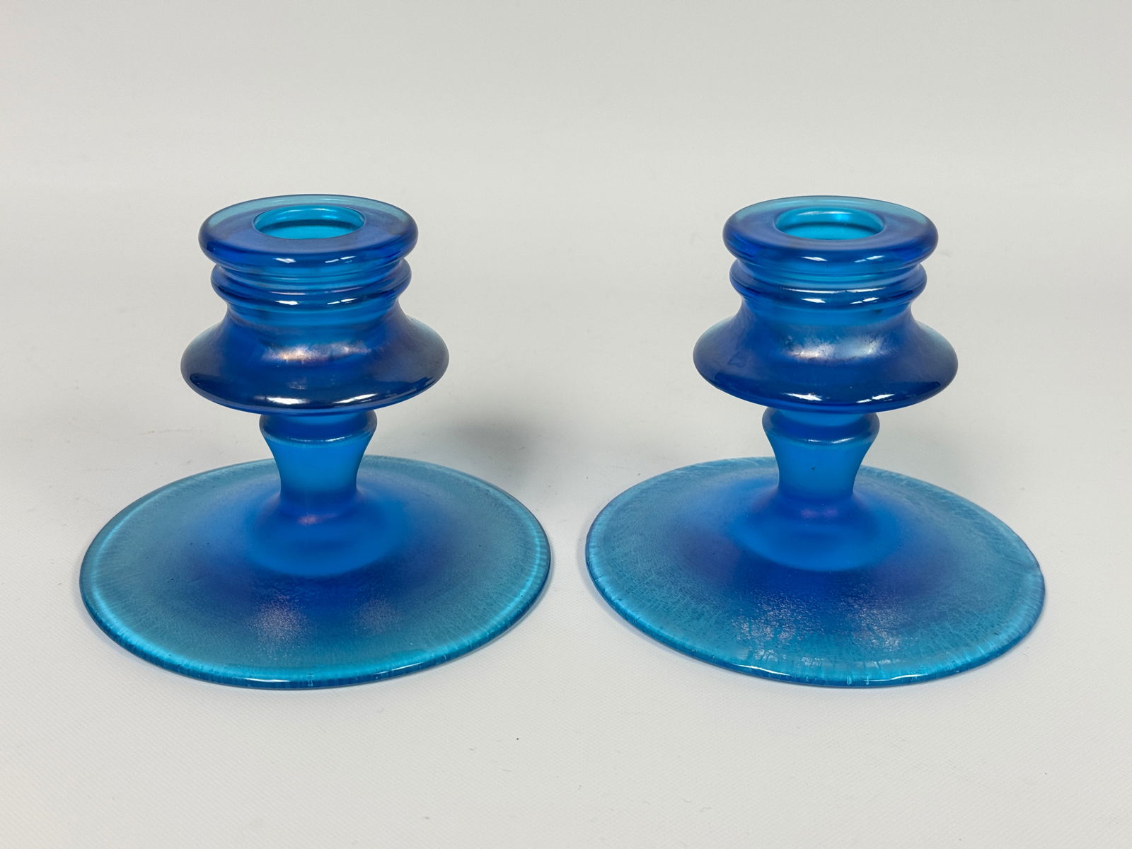 FENTON CELESTE BLUE IRIDESCENT CANDLESTICKS: BOTH REMAIN IN VERY GOOD CONDITION, NO CHIPS OR CRACKS.