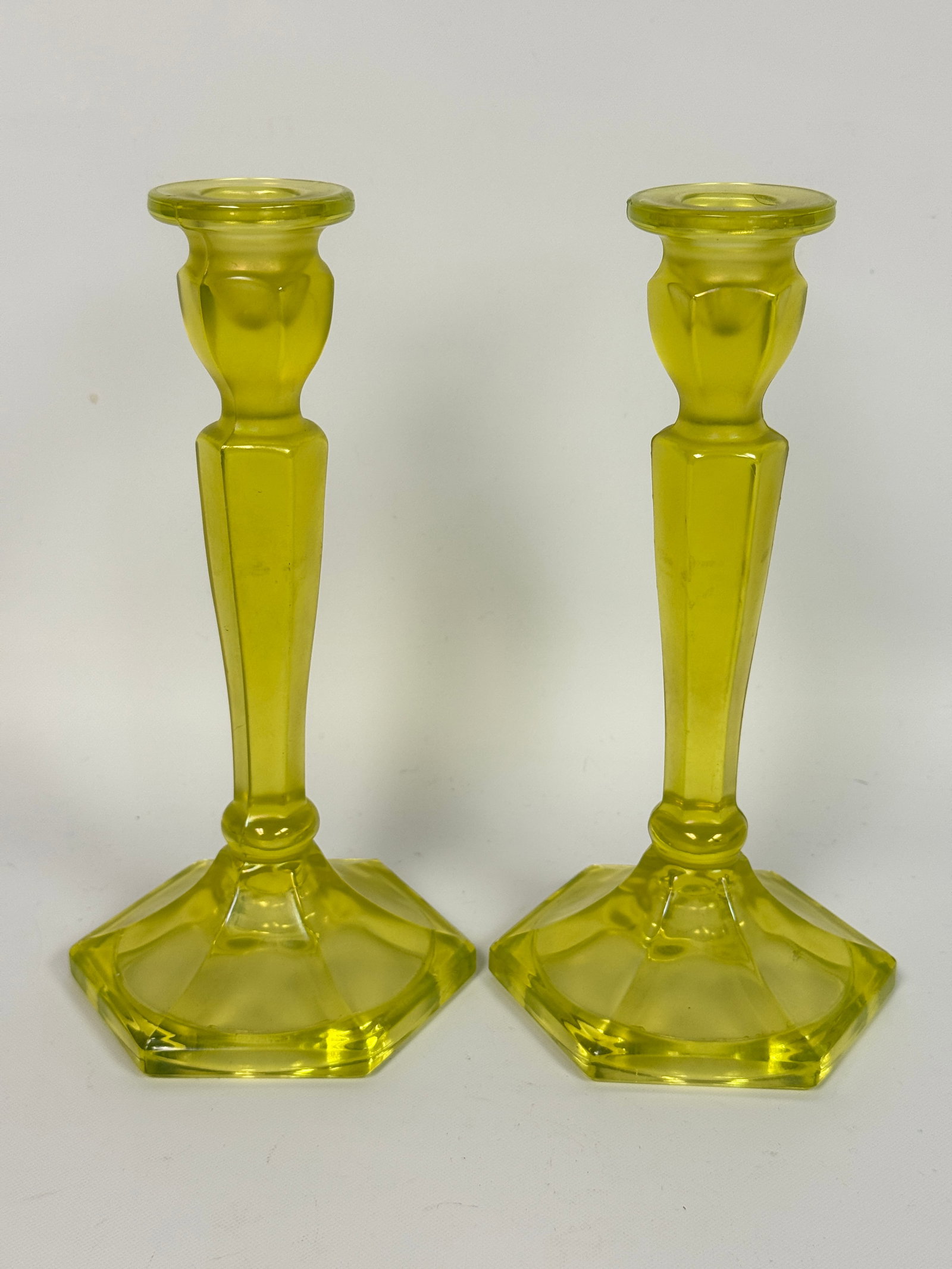 PAIR OF URANIUM GLASS CANDLESTICKS: BOTH REMAIN IN VERY GOOD CONDITION, NO CHIPS OR CRACKS.