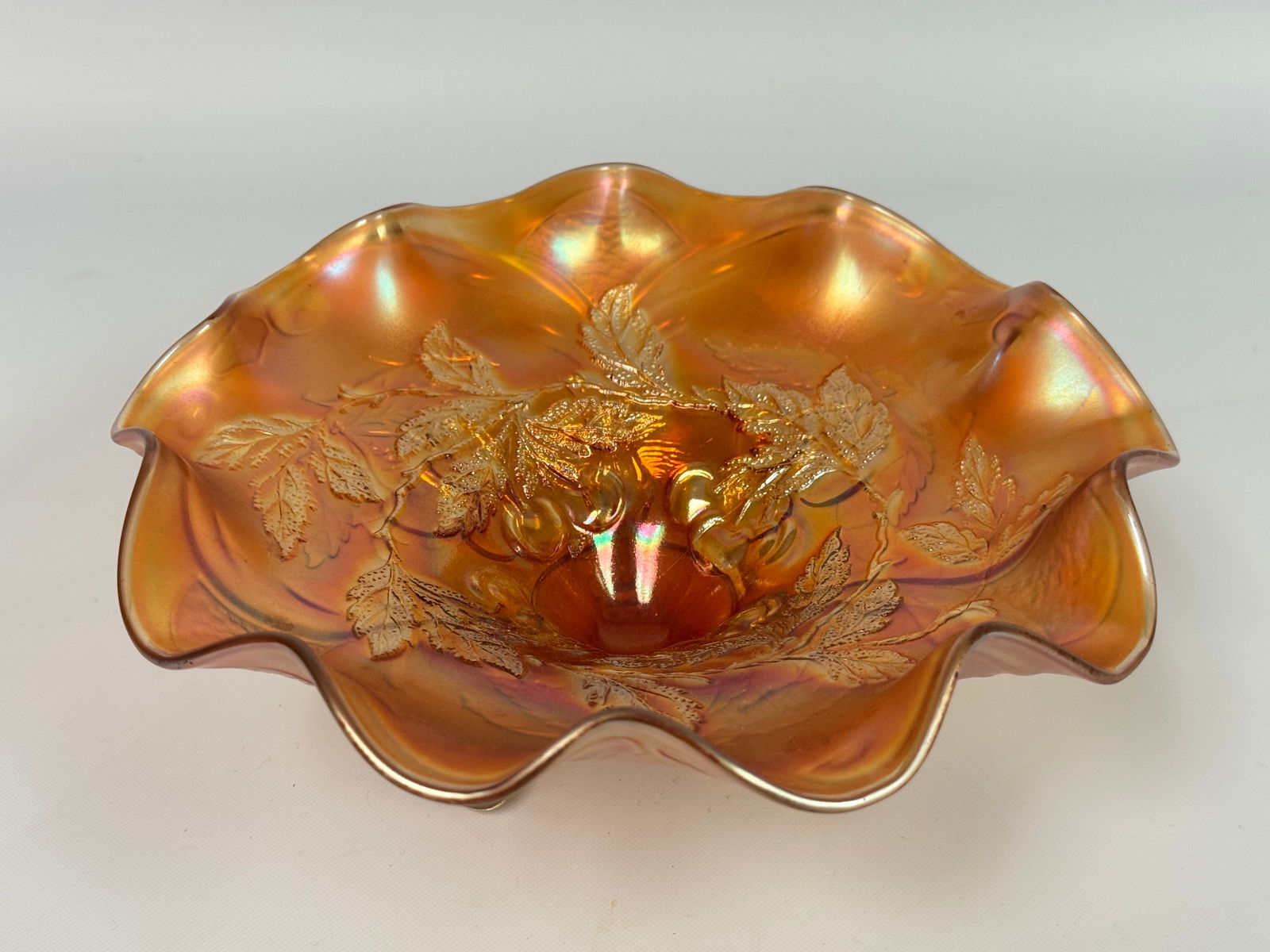 DUGAN CHERRIES MARIGOLD CARNIVAL GLASS BOWL: REMAINS IN VERY GOOD CONDITION, NO CHIPS OR CRACKS.