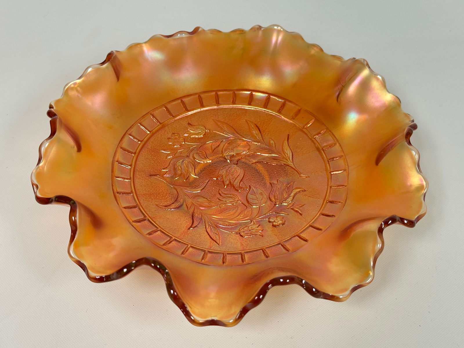 DUGAN WINDFLOWER MARIGOLD CARNIVAL GLASS BOWL: REMAINS IN VERY GOOD CONDITION, NO CHIPS OR CRACKS.