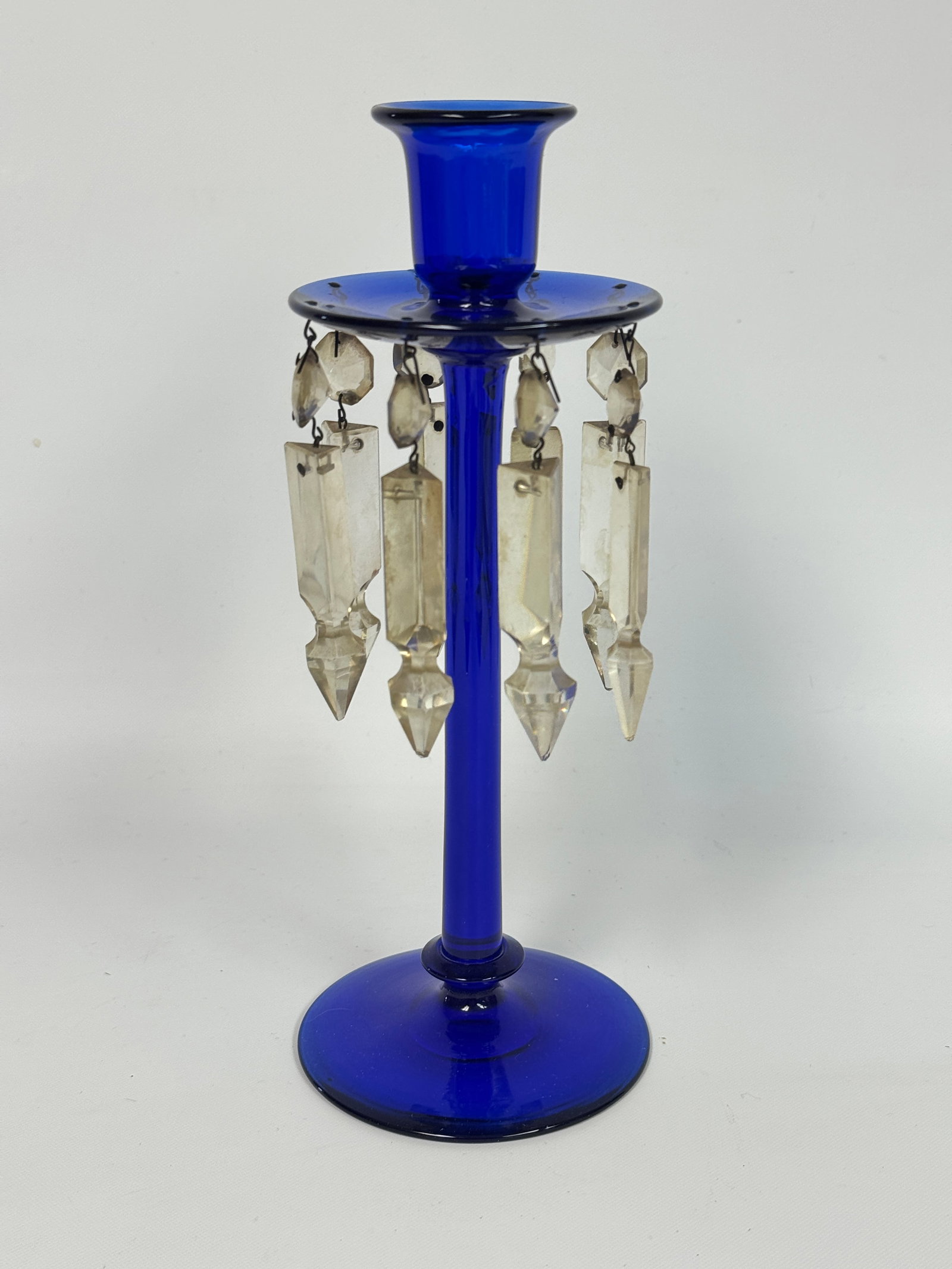 COBALT BLUE GLASS DROP PRISM CANDLE HOLDER: REMAINS IN VERY GOOD CONDITION, NO CHIPS OR CRACKS. SOME OF THE PRISMS ARE DIRTY, NEEDING CLEANED.
