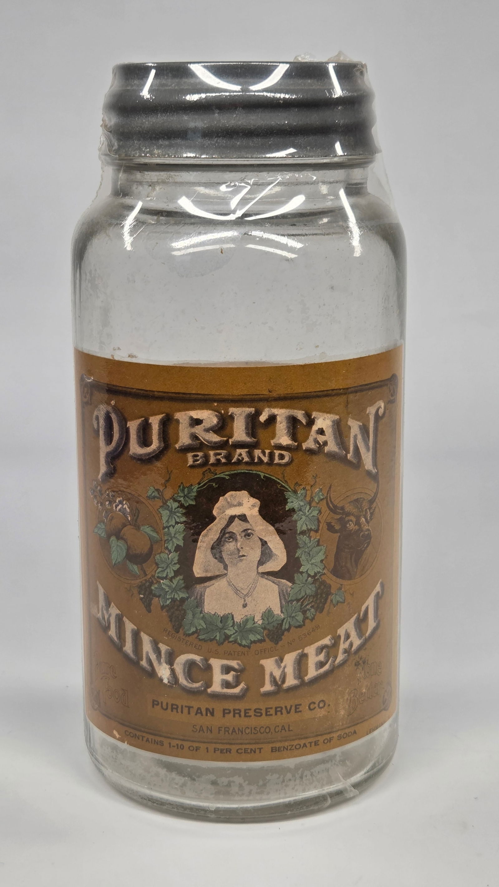 EARLY PURITAN BRAND MINCE MEAT GLASS JAR W/ LABEL: LABELS REMAIN IN VERY GOOD CONDITION. NO CHIPS OR CRACKS IN JAR. PLASTIC WRAPPED.