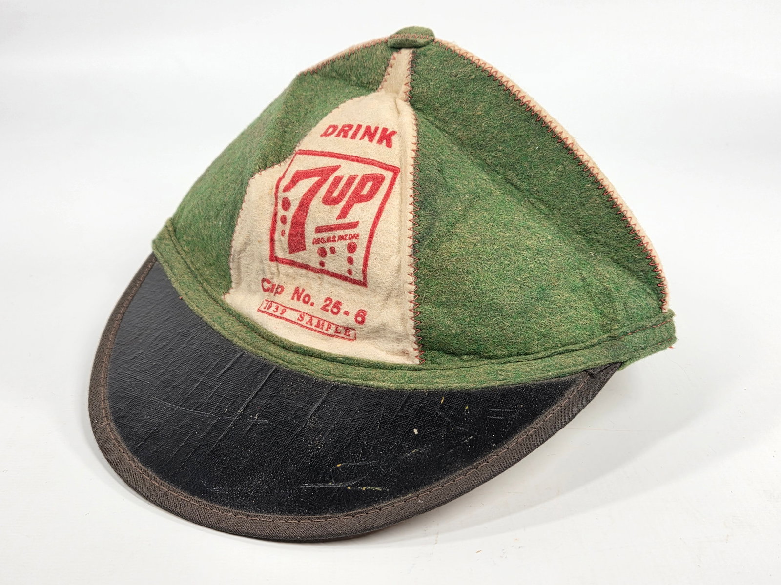1939 DRINK 7UP SAMPLE FELT HAT: REMAINS IN VERY GOOD UNUSED CONDITION, SHOWING SOME STORAGE WEAR.