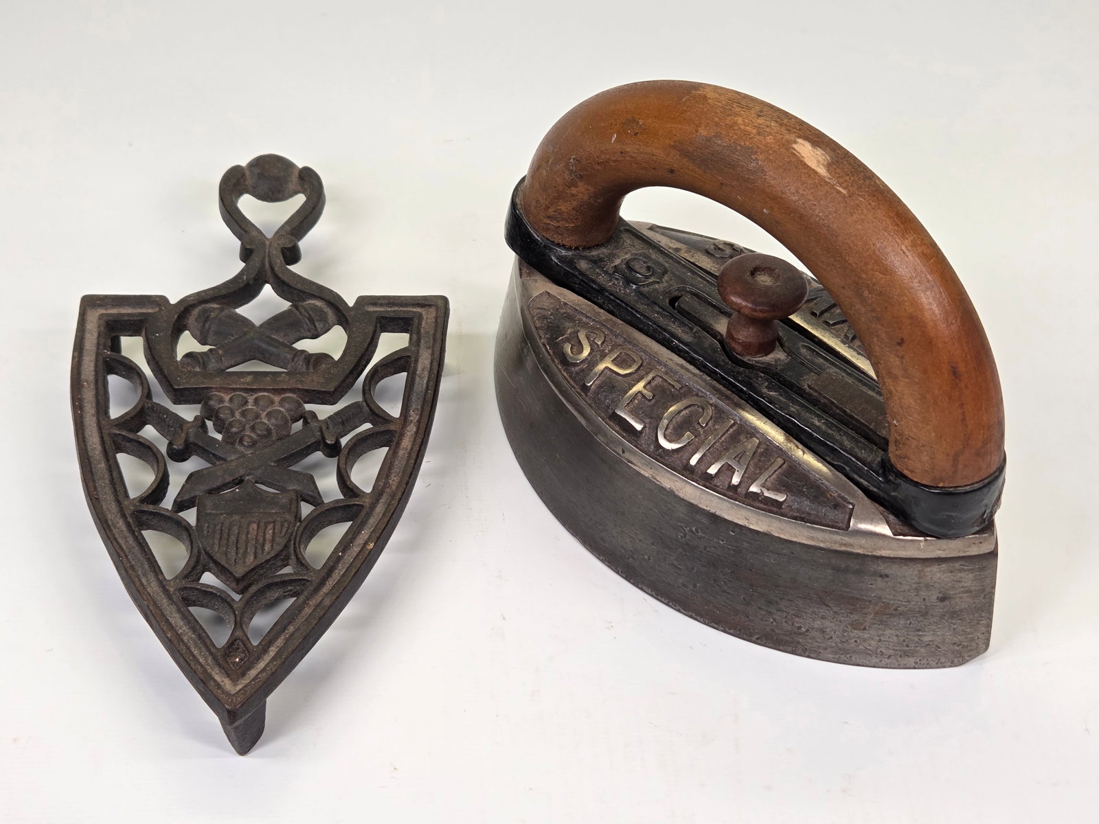 SIMMONS SPECIAL SAD IRON & MILITARY TRIVET: BOTH REMAIN IN GOOD CONDITION, SHOWING SOME TYPICAL USAGE WEAR.