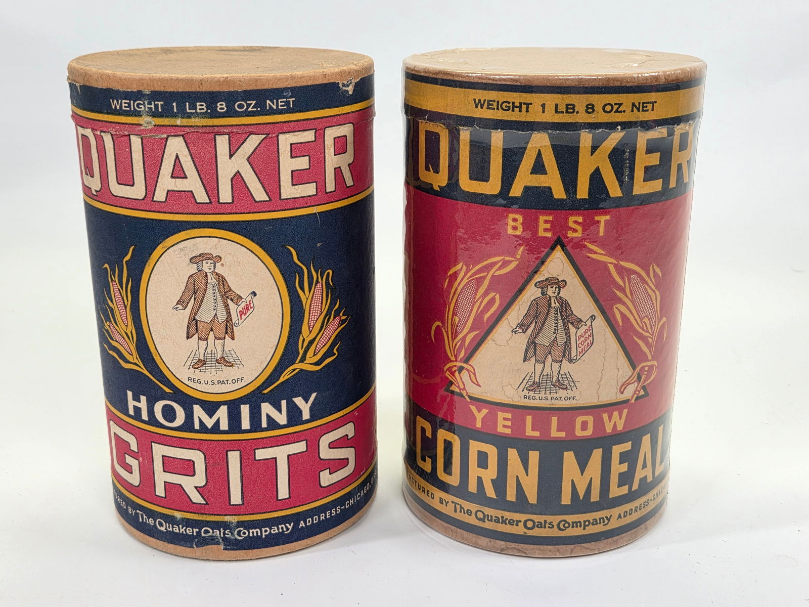 QUAKER HOMINY GRITS & CORN MEAL CONTAINERS: BOTH REMAIN IN GOOD CONDITION, SHOWING SOME TYPICAL WEAR. ONE PLASTIC WRAPPED FOR DISPLAY.