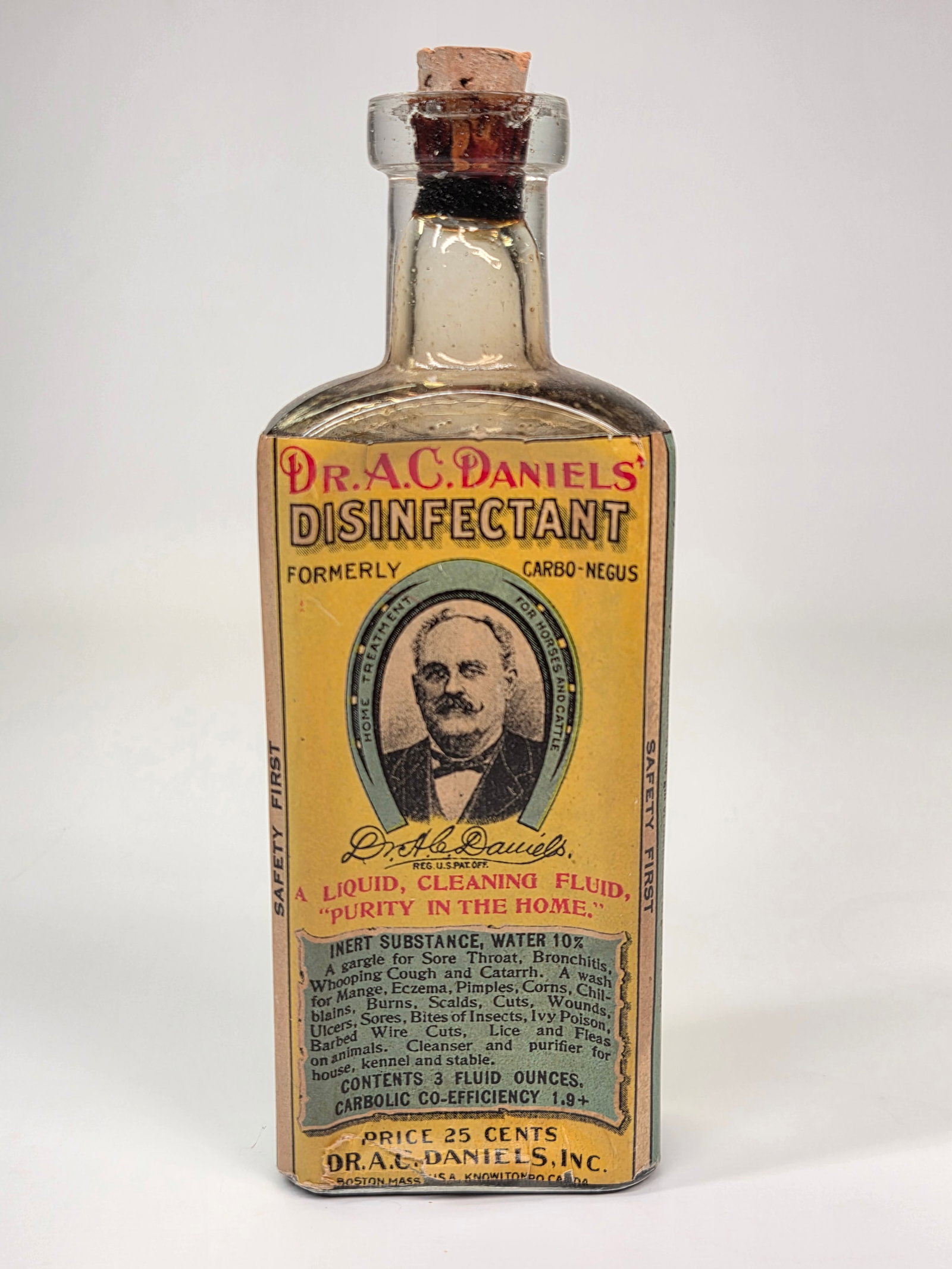 DR. A. C. DANIELS' DISINFECTANT BOTTLE W/ PAPER LABEL: REMAINS IN GOOD CONDITION, SHOWING SOME TYPICAL WEAR TO PAPER LABEL. BOTTLE NEAR FULL.