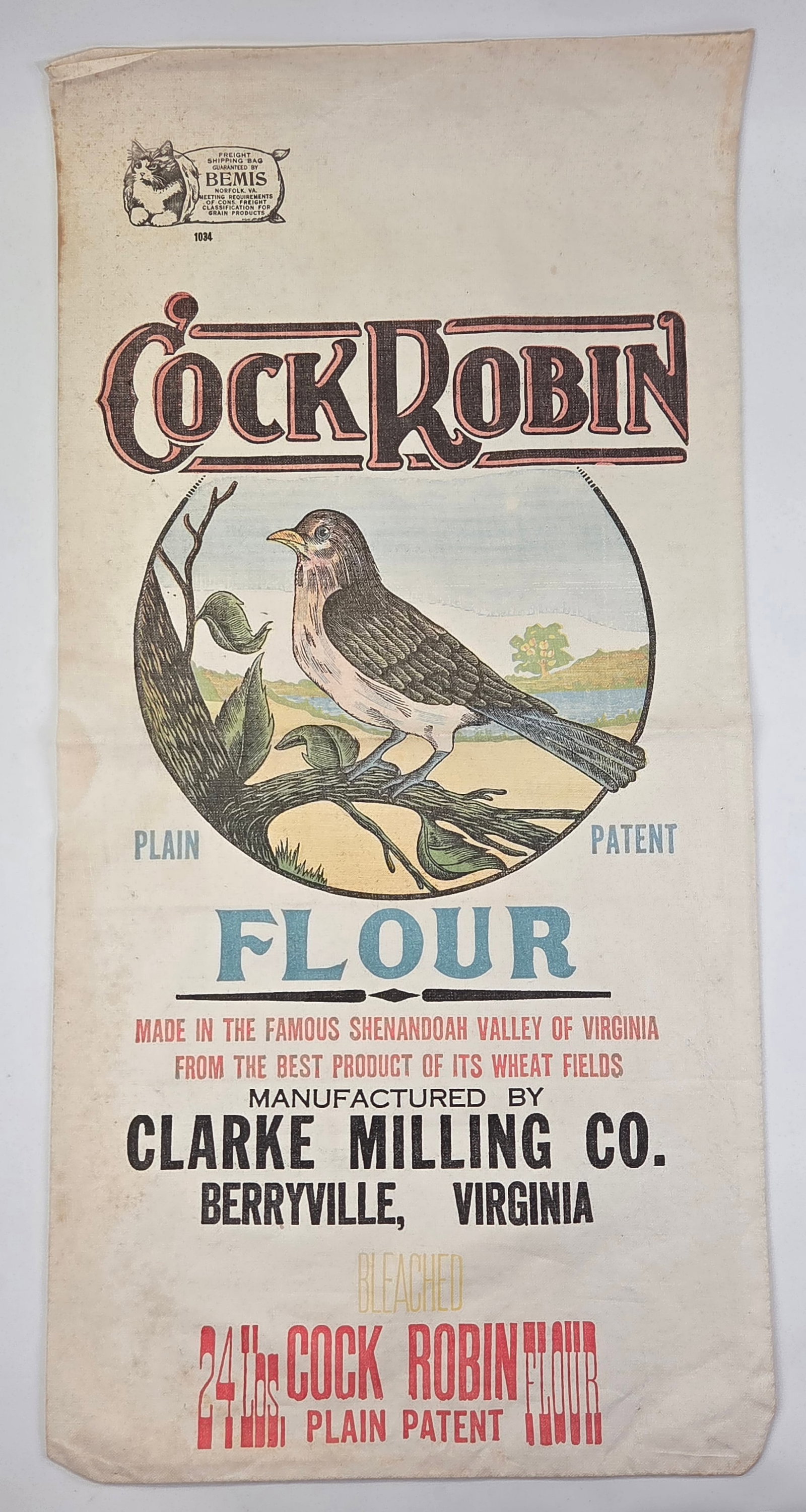 CLARKE MILLING CO. COCK ROBIN FLOUR PAPER BAG: REMAINS IN GOOD CONDITION, SHOWING SOME TYPICAL WEAR.
