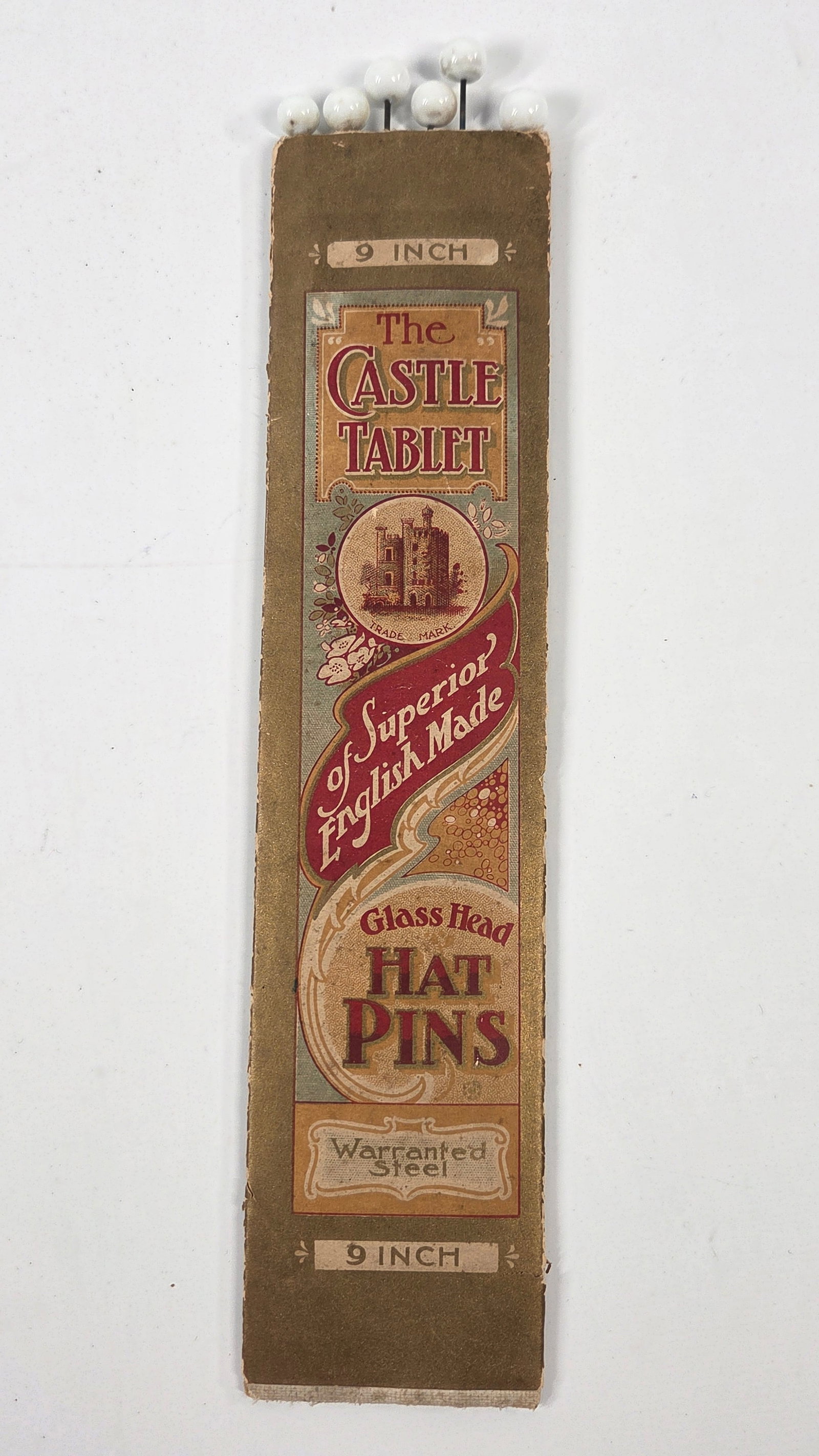 THE CASTLE TABLE GLASS HEAD HAT PINS: SET REMAINS IN VERY GOOD CONDITION WITH PACKAGE. PACKAGE SHOWING SOME WEAR.