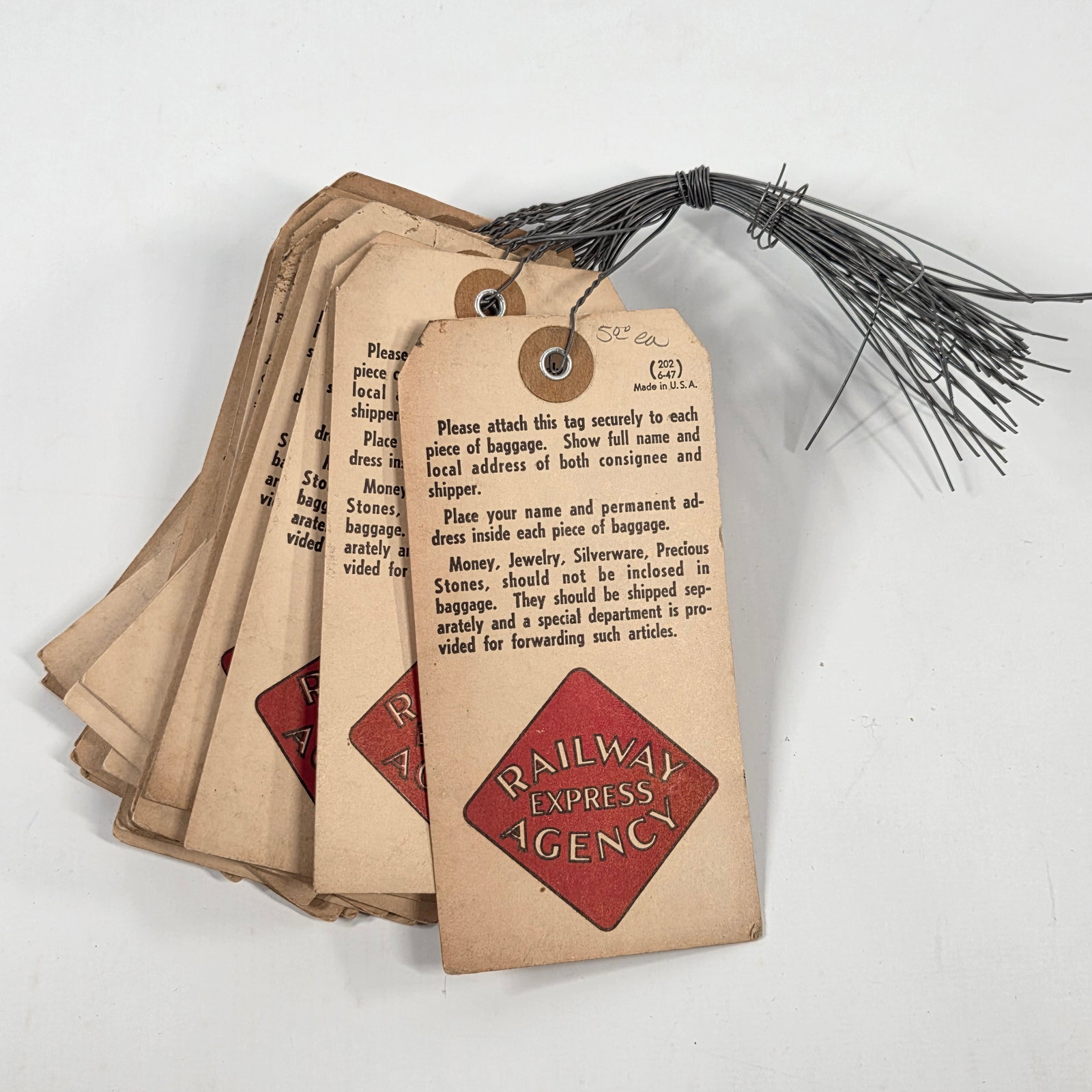 29) UNUSED RAILWAY EXPRESS AGENCY LUGGAGE TAGS: ALL REMAIN IN VERY GOOD UNUSED CONDITION, SHOWING SOME TYPICAL WEAR CONSISTENT WITH AGE.