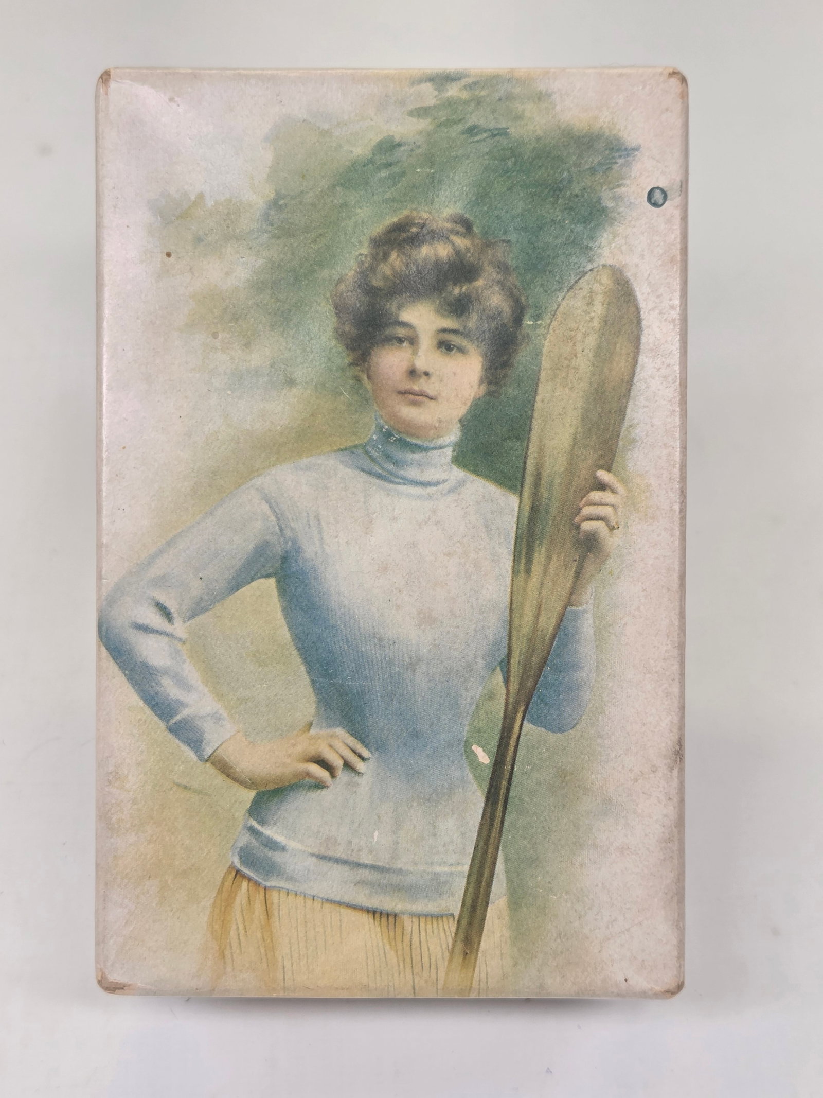 NATIONAL CANDY CO. CHATEAU CHOCOLATS CANOE GIRL BOX: EMPTY BOX REMAINS IN GOOD CONDITION, SHOWING SOME TYPICAL WEAR.