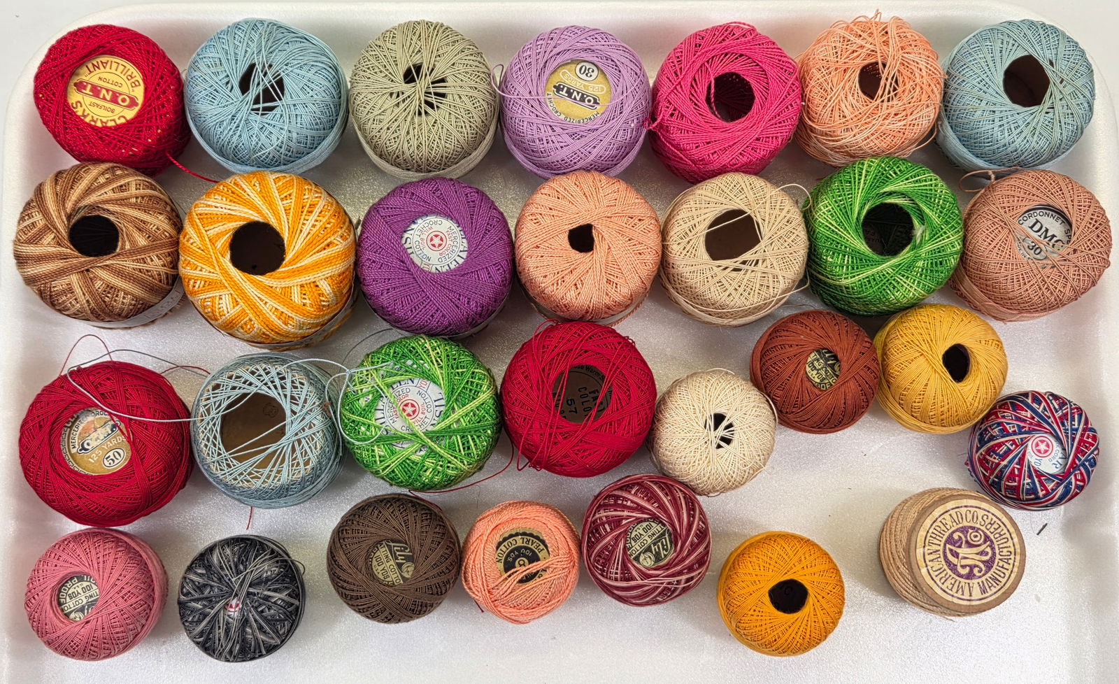 ASSORTMENT OF VARIOUS UNUSED SEWING THREAD: ALL REMAIN IN VERY GOOD UNUSED CONDITION. 29 PIECES.