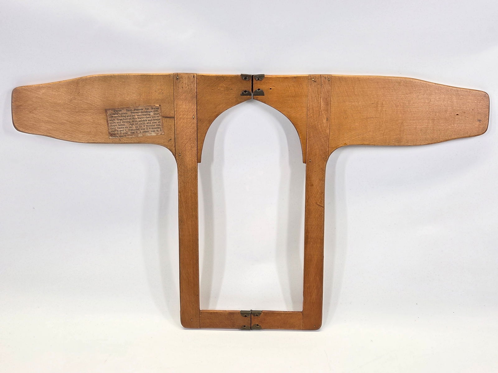 ANTIQUE WOOD CHILD'S SHIRT FORM DRYER: REMAINS IN GOOD CONDITION, SHOWING TYPICAL WEAR.