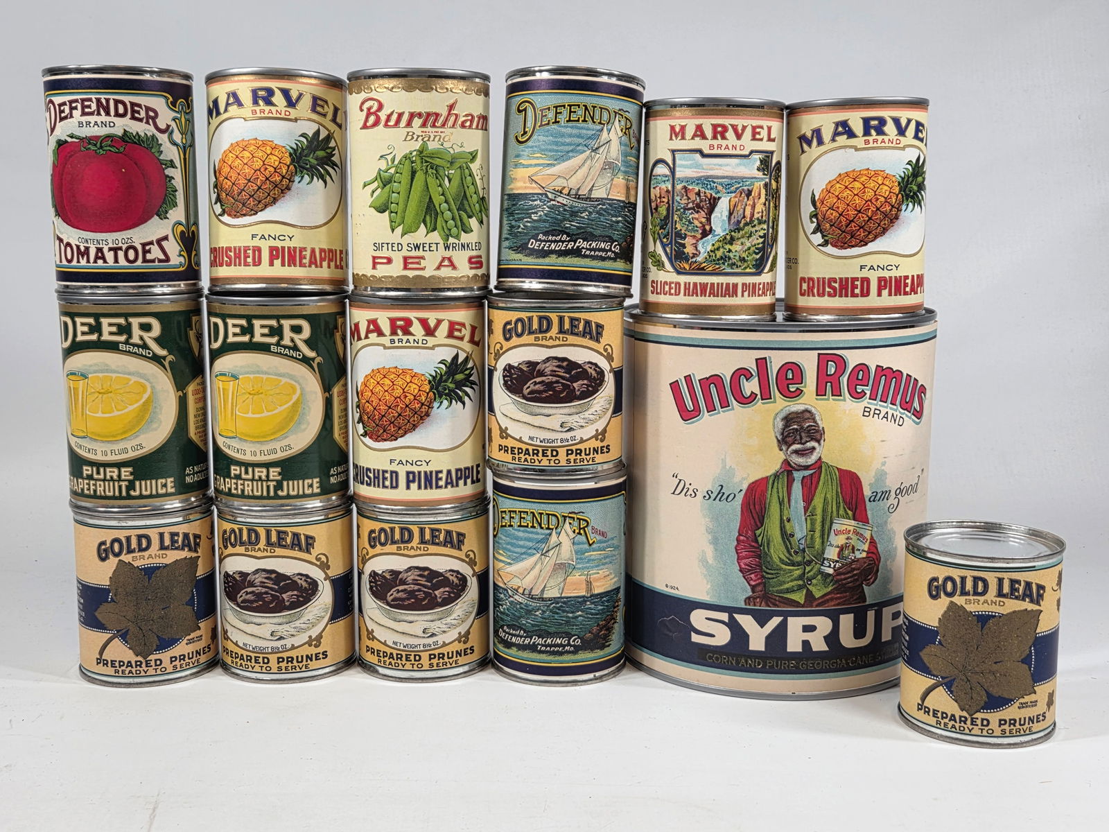 ASSORTMENT OF REPRODUCTION TINS W/ LABELS: ALL REPRODUCTIONS REPRODUCTIONS REMAIN IN VERY GOOD CONDITION.