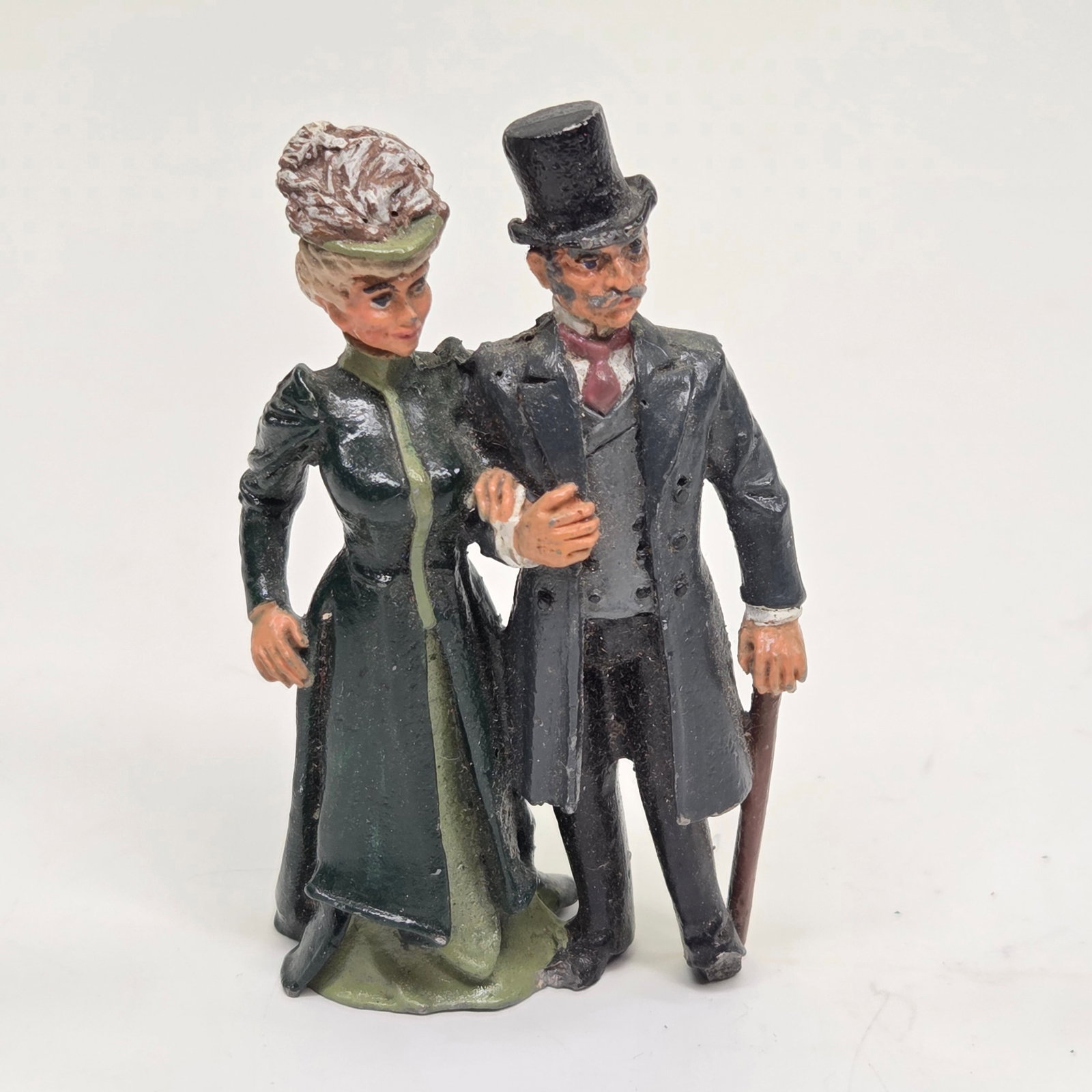 LEAD HAND PAINTED VICTORIAN COUPLE AT BALL: REMAINS IN GOOD CONDITION, SHOWING SOME TYPICAL WEAR.
