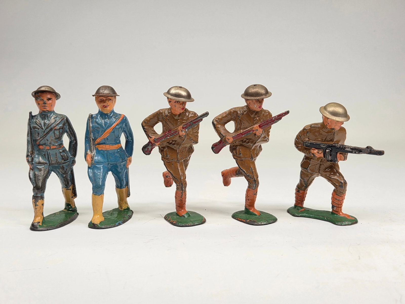 5) BARCLAY MANOIL LEAD MILITARY SOLDIERS: ALL REMAIN IN GOOD CONDITION, SHOWING SOME TYPICAL WEAR.