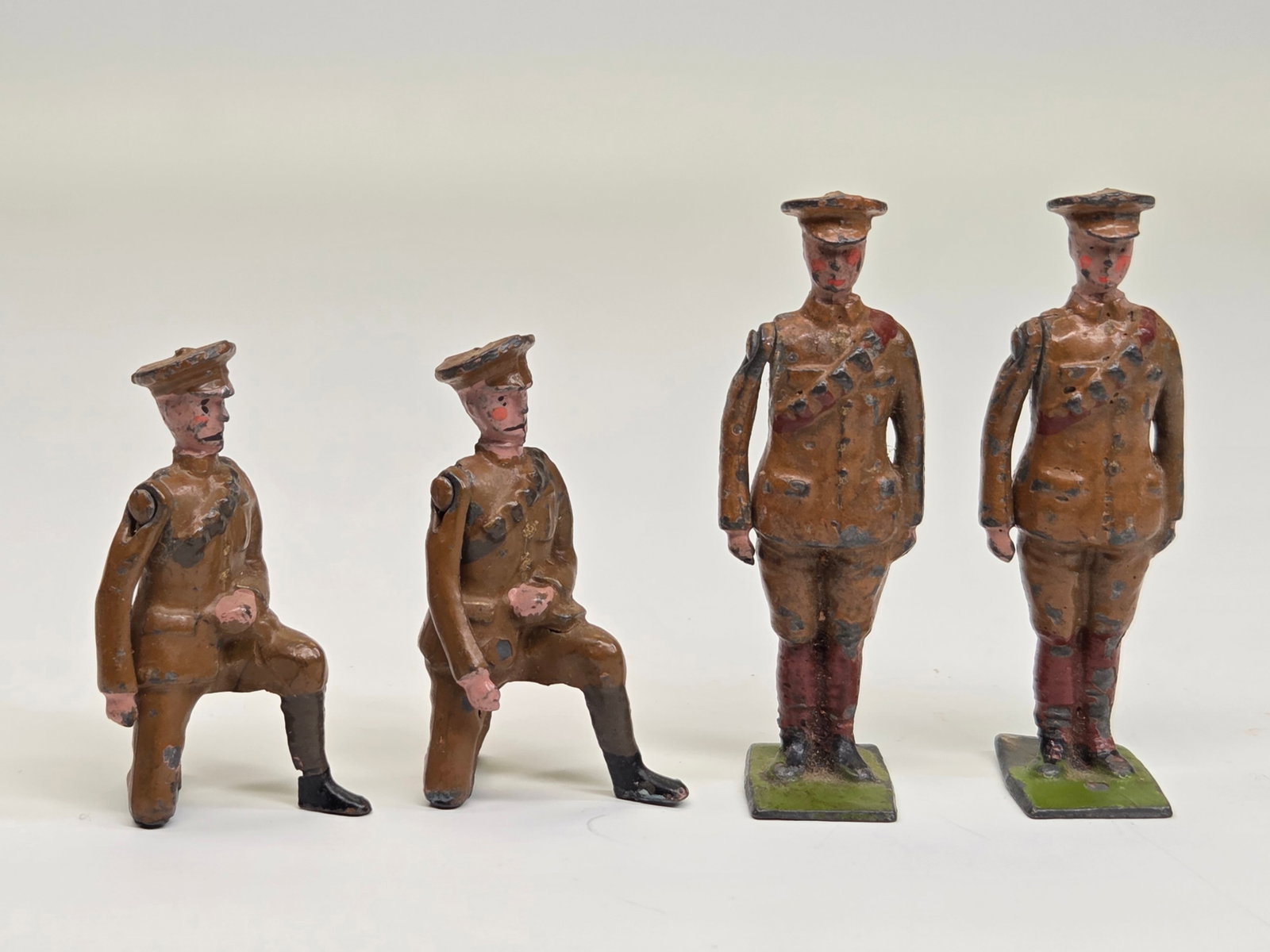 4) VINTAGE BRITAINS LEAD SOLDIERS: ALL REMAIN IN FAIR CONDITION, SHOWING PAINT WEAR.