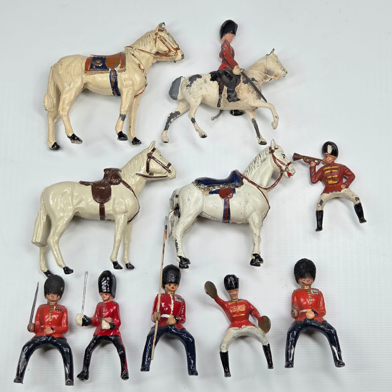 VARIOUS VINTAGE LEAD SOLDIER MOUNTED GUARDS: ALL REMAIN IN FAIR TO GOOD CONDITION, SHOWING SOME TYPICAL PAINT WEAR.