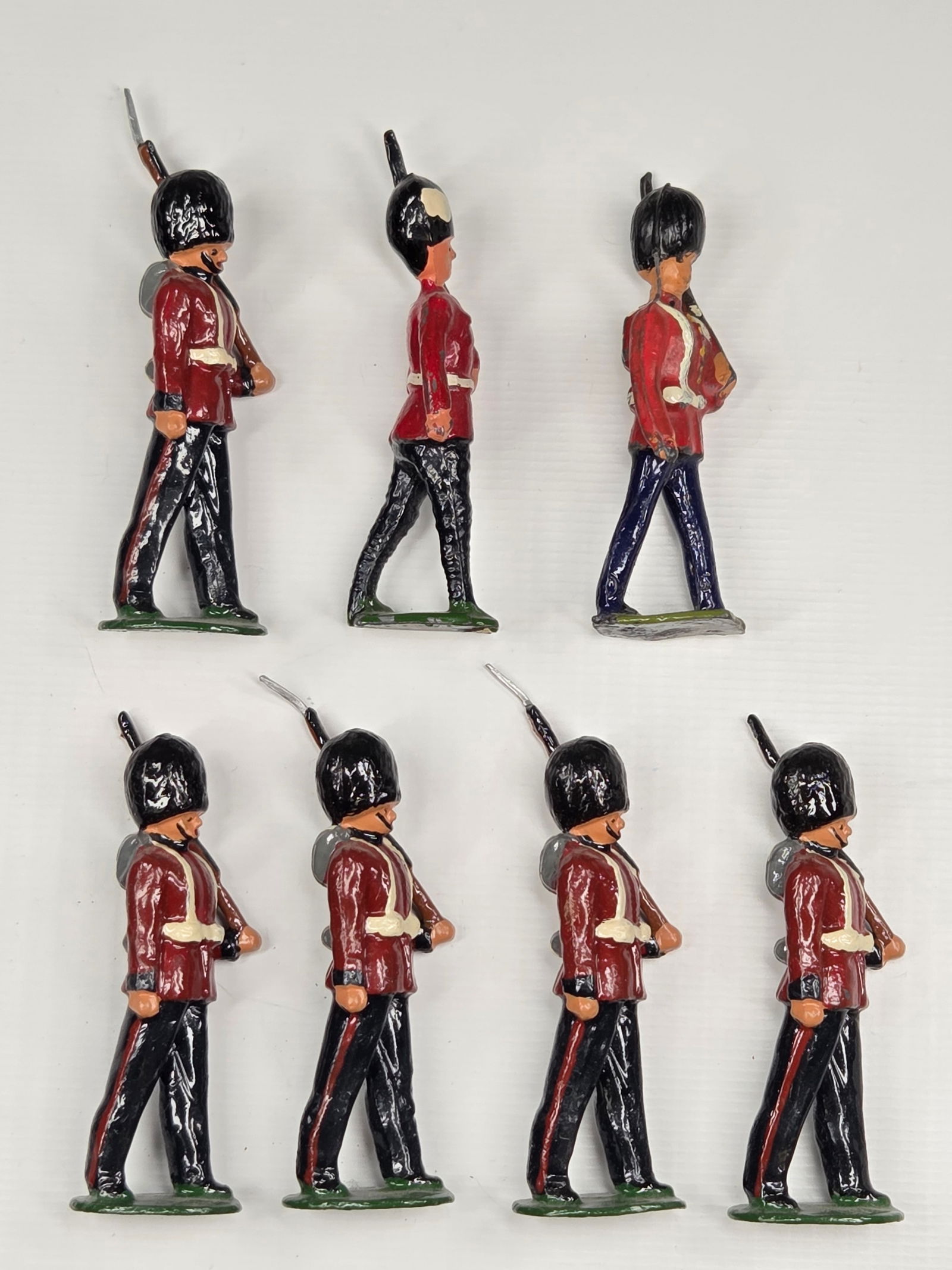 7) VINTAGE BRITAIN COLDSTREAM GUARDS REPAINT: 5 REMAIN IN VERY GOOD REPAINT CONDITION. 2 ORIGINAL, SHOWING PAINT WEAR.
