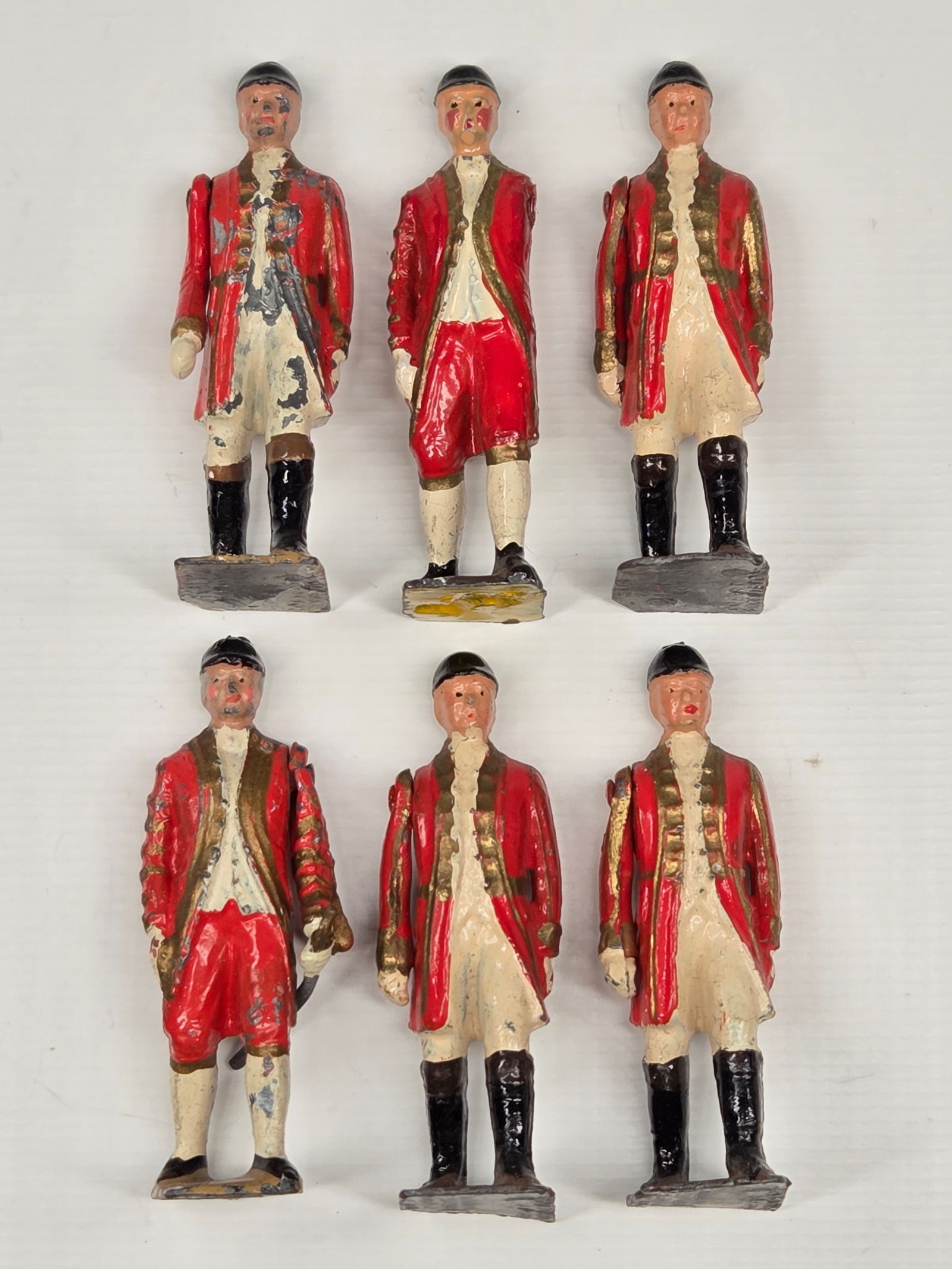 6) VINTAGE BRITAIN FOOTMEN OF THE STATE COACH: ALL REMAIN IN GOOD CONDITION, SHOWING SOME TYPICAL PAINT WEAR. ONE WITH MISSING ARM.