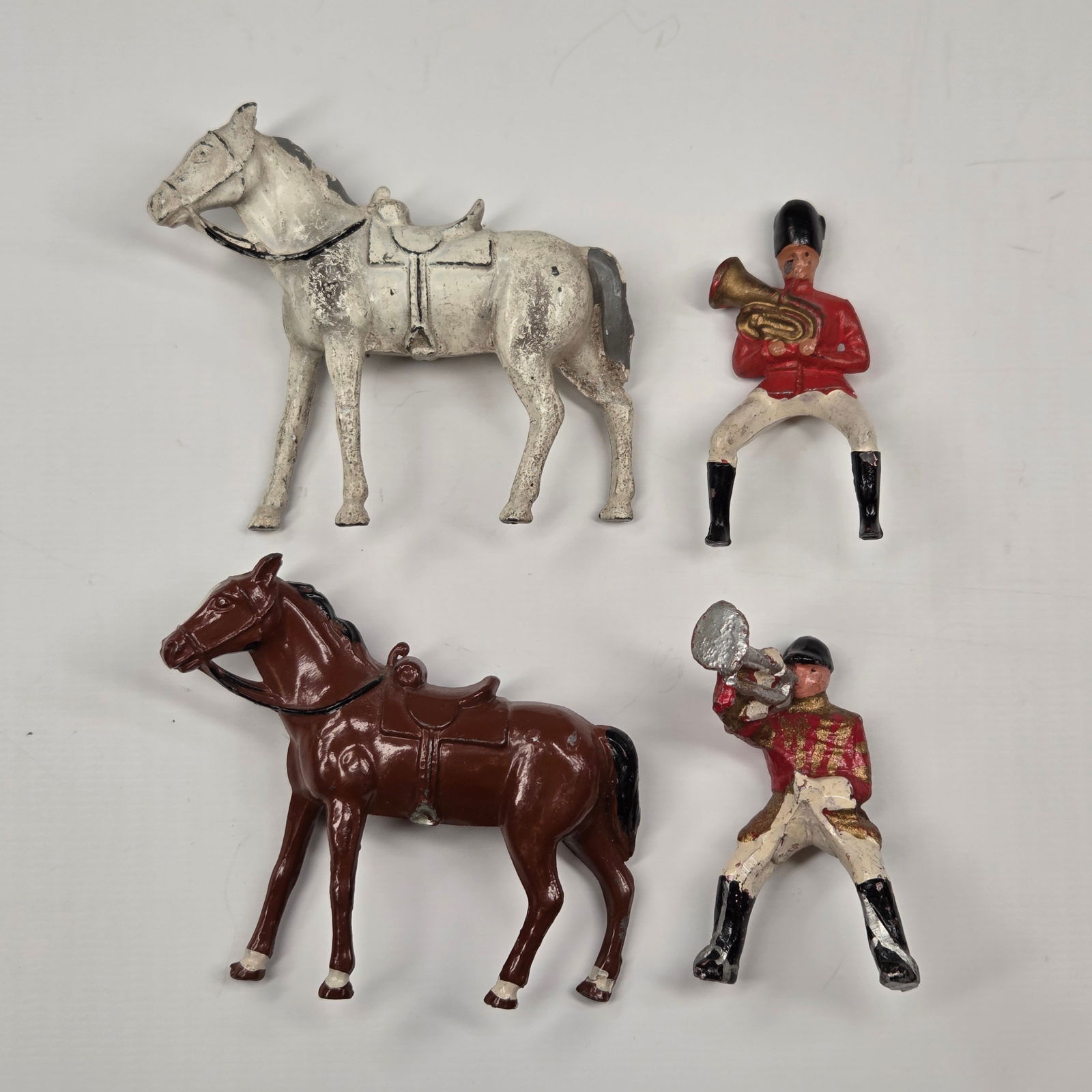 2) VINTAGE MOUNTED SOLDIERS: BOTH REMAIN IN FAIR TO GOOD CONDITION, SHOWING PAINT WEAR.