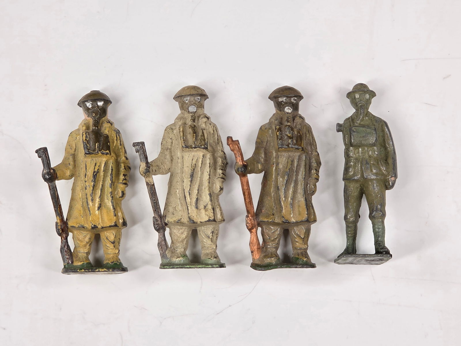 4) JOHILLCO BRITISH INFANTRY W/ GAS MASK: ALL REMAIN IN FAIR CONDITION, SHOWING PAINT WEAR.