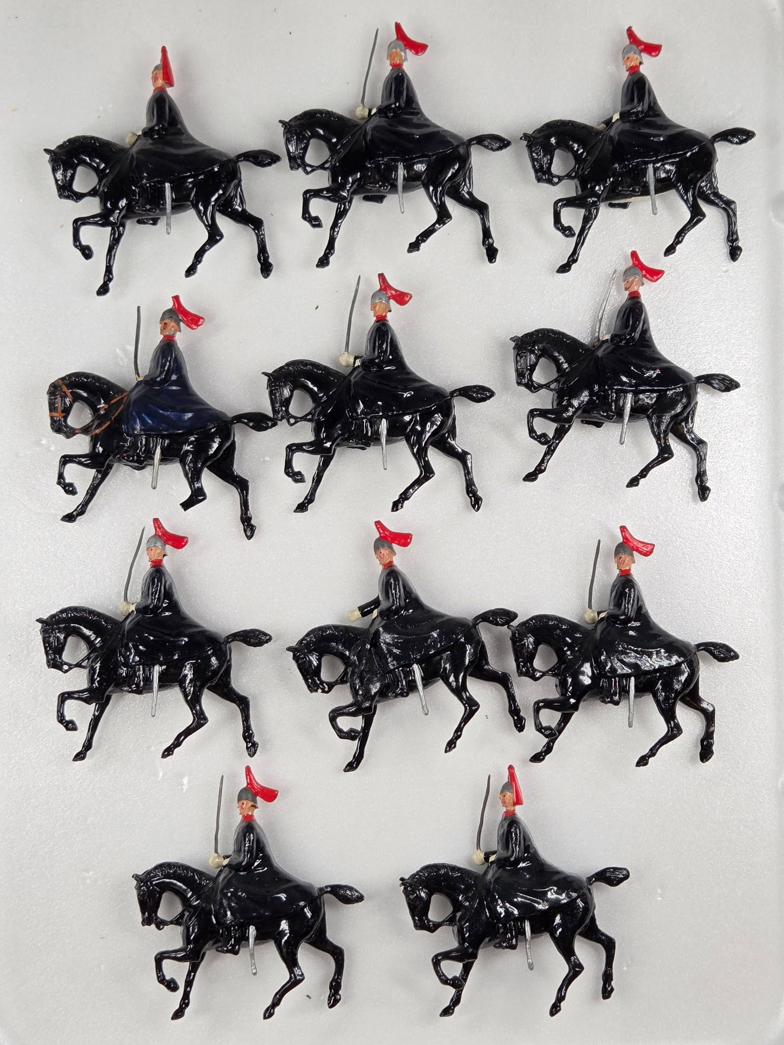 SET OF 11 VINTAGE BRITAINS ROYAL HORSE GUARDS: ALL REMAIN IN FAIR TO GOOD CONDITION, SHOWING SOME TYPICAL PAINT WEAR. TWO SOLDIERS WITH BROKEN SWORDS. ONE HORSE WITH BROKEN / MISSING LEG.