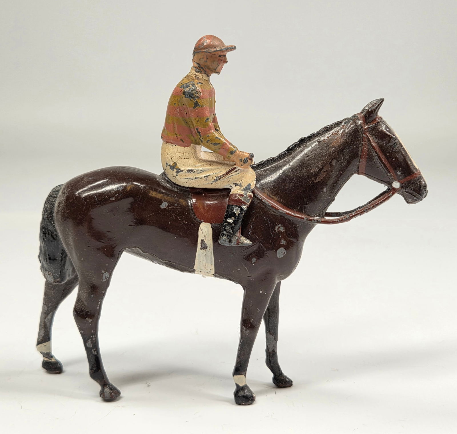 VINTAGE BRITAIN LEAD JOCKEY W/ HORSE: REMAINS IN GOOD CONDITION, SHOWING SOME TYPICAL PAINT WEAR.