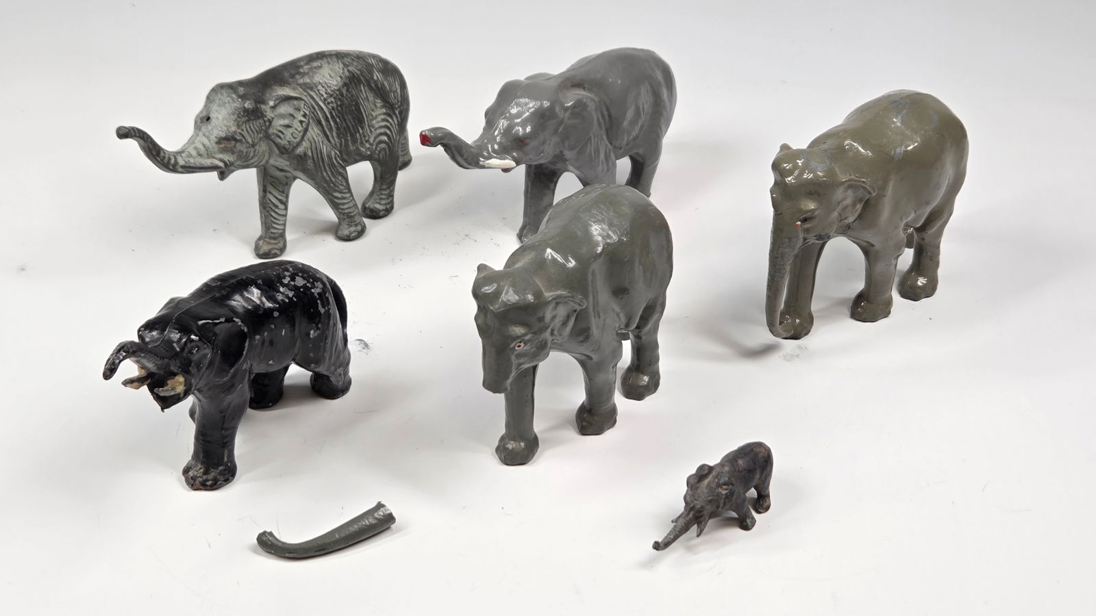 6) VINTAGE LEAD ELEPHANT: ALL REMAIN IN FAIR TO GOOD CONDITION, SHOWING SOME TYPICAL WEAR. ONE WITH BROKEN TRUNK.