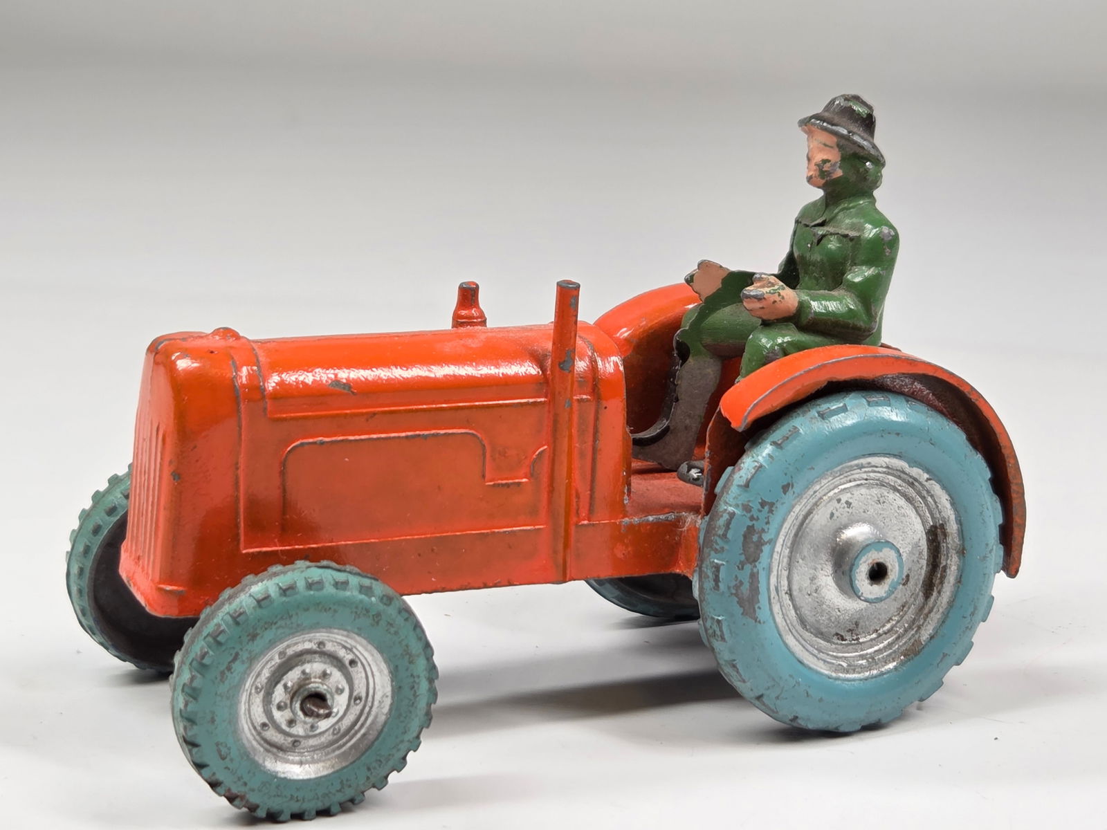 VINTAGE ENGLAND LEAD TRACTOR W/ FARMER: REMAINS IN GOOD CONDITION, SHOWING SOME TYPICAL WEAR.