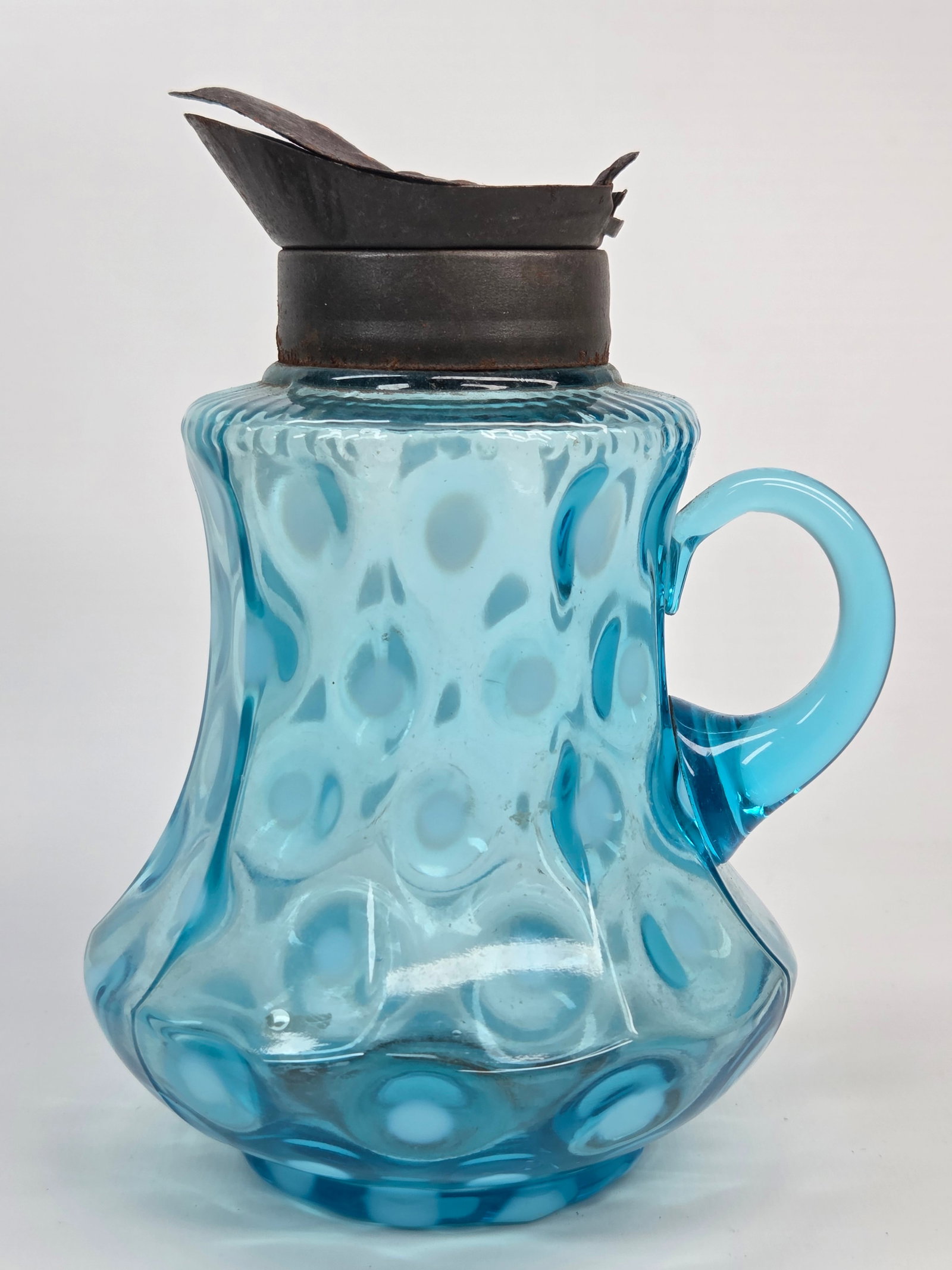 ANTIQUE BLUE OPALESCENT COIN SPOT 9-PANEL GLASS SYRUP PITCHER: REMAINS IN GOOD CONDITION, SHOWING SOME TYPICAL USAGE WEAR. LID BROKEN, SHOWING SOME WEAR.