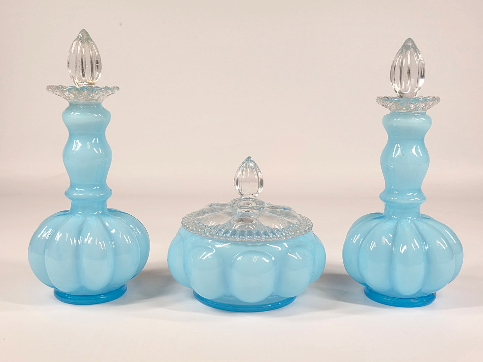 FENTON BLUE MELON GLASS VANITY set: REMAINS IN GOOD CONDITION, SHOWING SOME TYPICAL WEAR. NO CHIPS OR CRACKS.